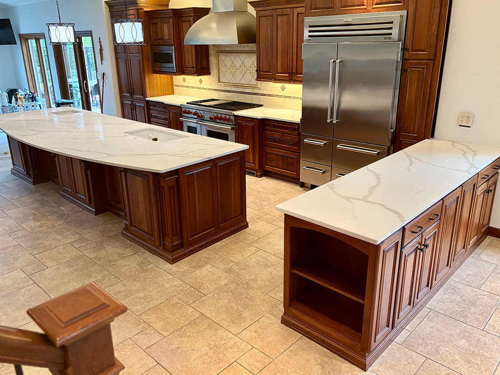 Luxury Double Island Kitchen: Cream quartz kitchen countertops for double island layout in Johnston, IA - Quartz Impressions