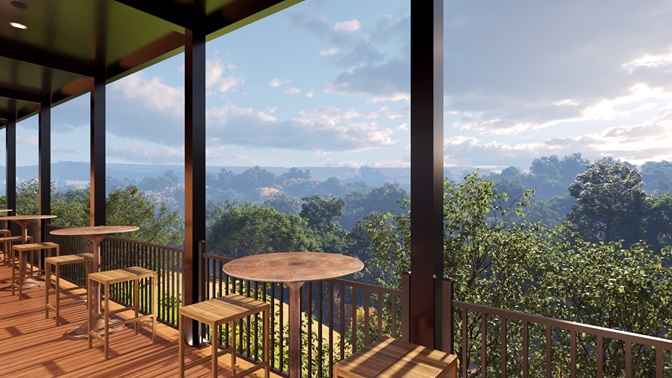 Outdoor wooden patio with high stools and tables overlooking a lush green forest under a cloudy sky.