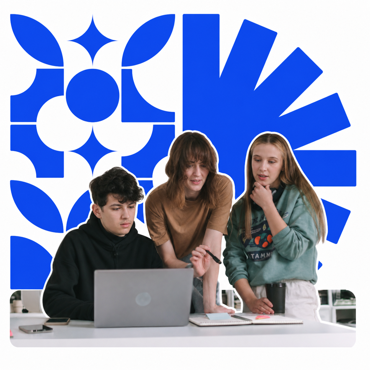 Three product team members collaborating around a laptop
