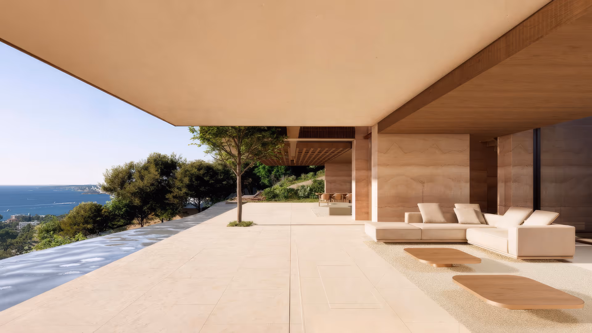 Blick unterhalb der überdachten Terrasse auf Entspannungsbereich und Pool.