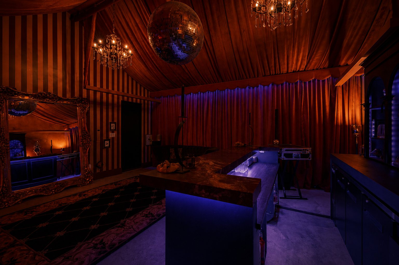 Speakeasy bar under a mirrored disco ball and crystal chandeliers