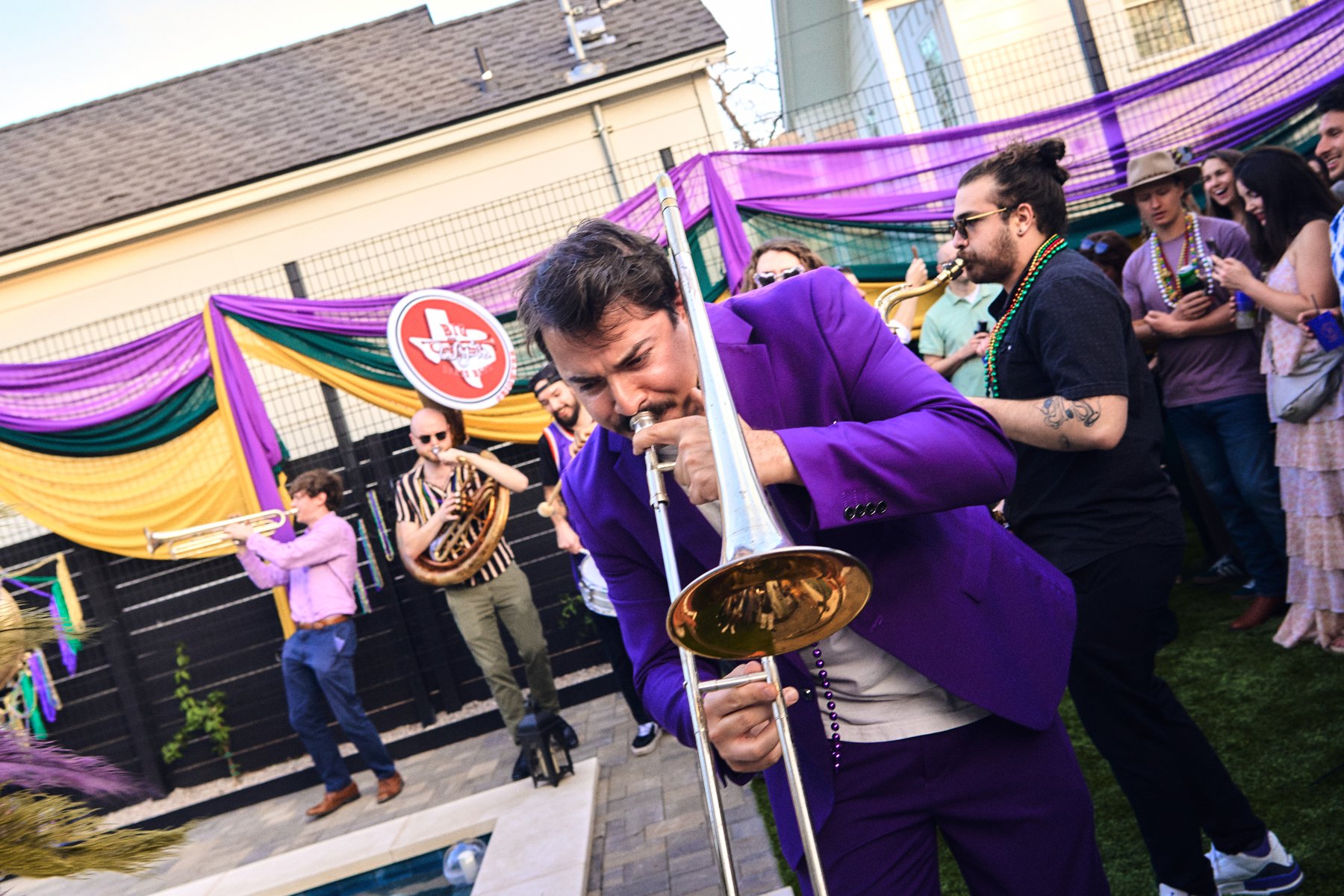 Brass band playing a Mardi Gras party in the Chateau Chloe courtyard