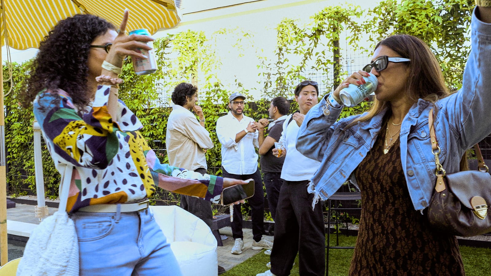 Friends cheering together outside Tenur House