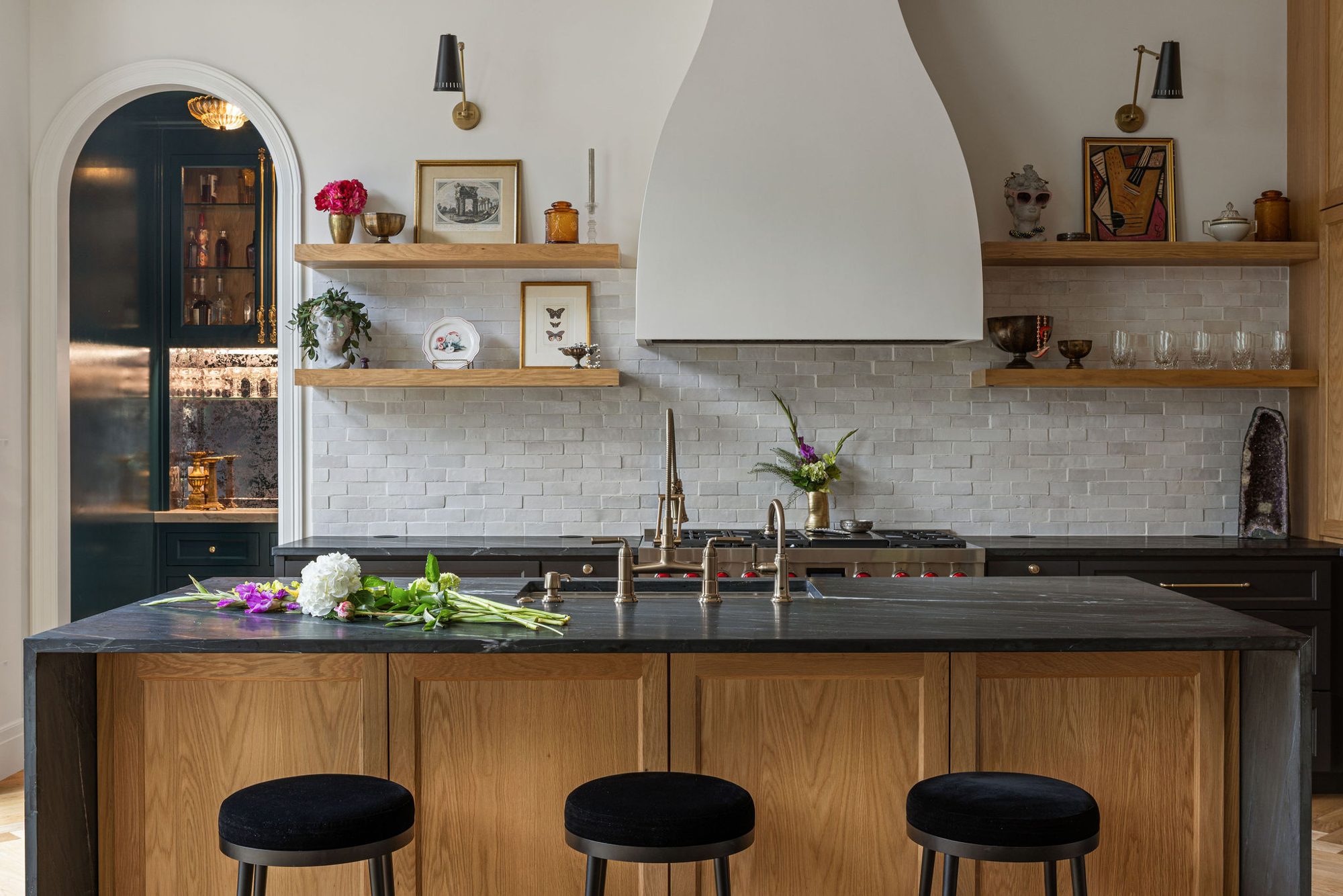 Designed kitchen with plaster hood and oak island