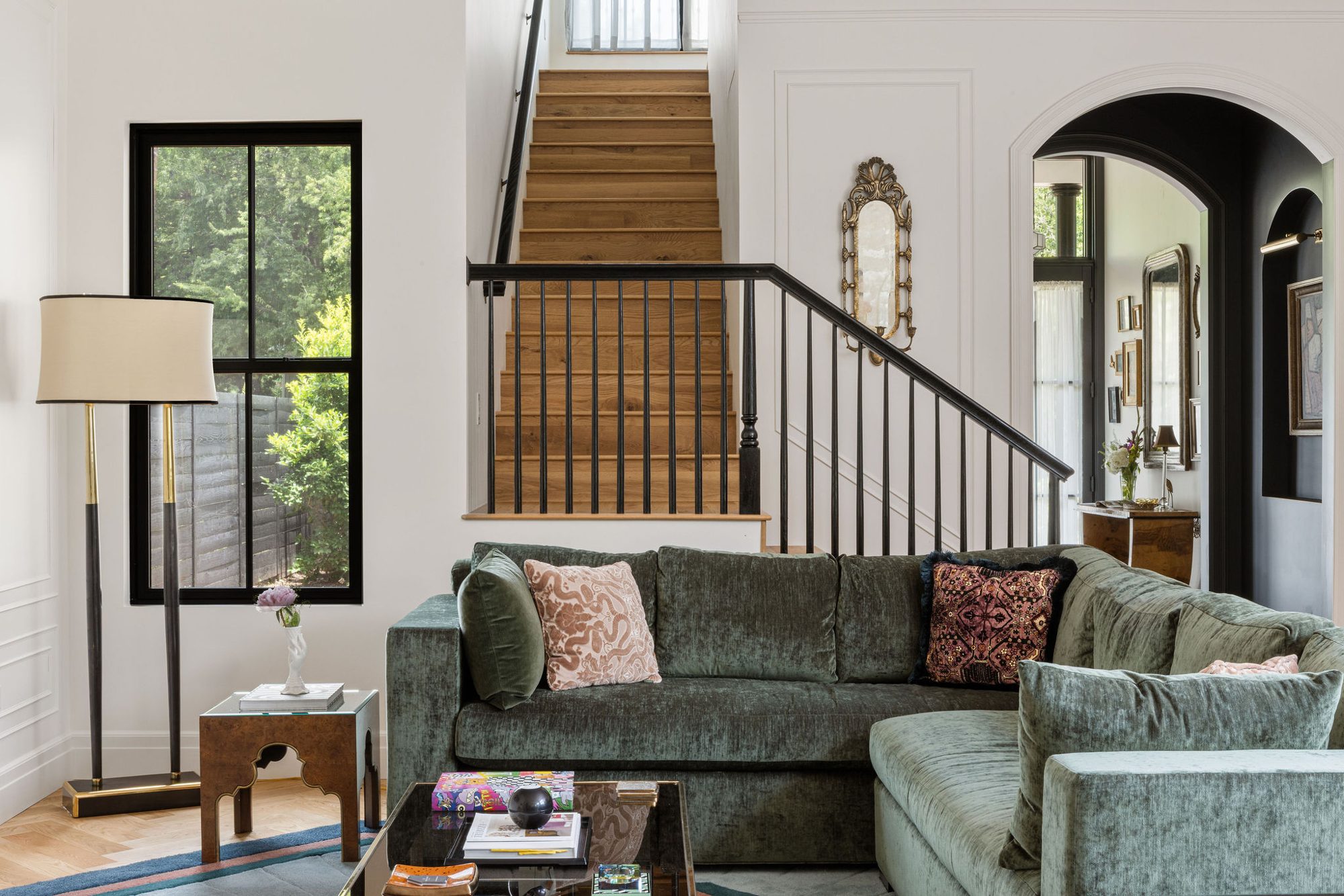 Living room with green velvet sofa at Chateau Chloe