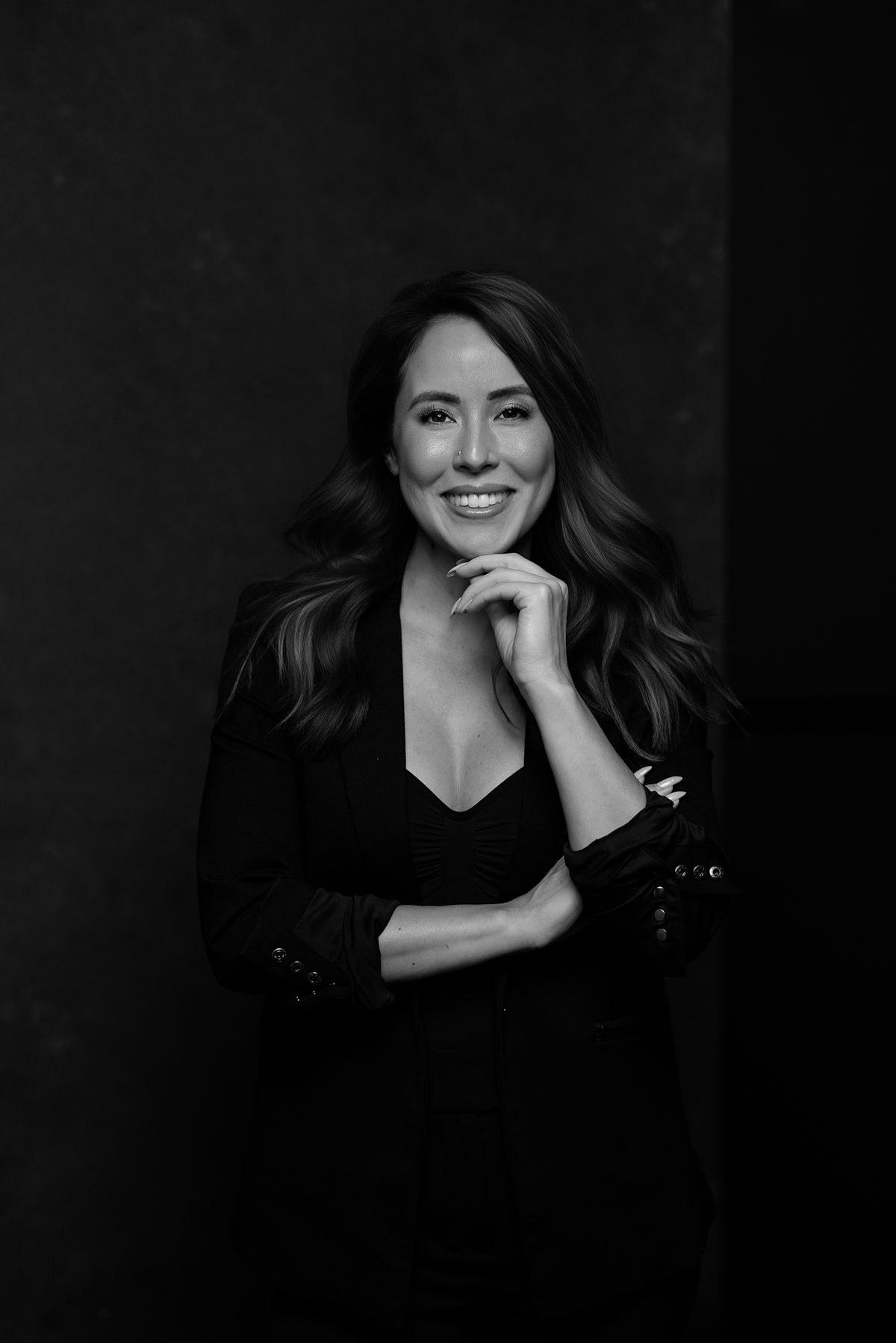 Chloe Chiang smiling in a black blazer
