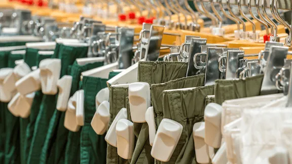 Pants hanging on a rack.