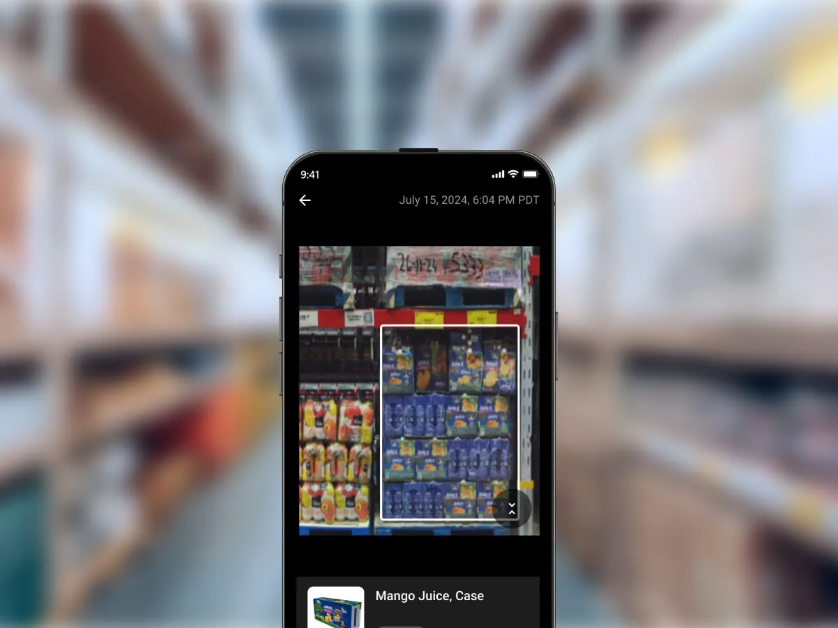 A phone app screen over a warehouse background.