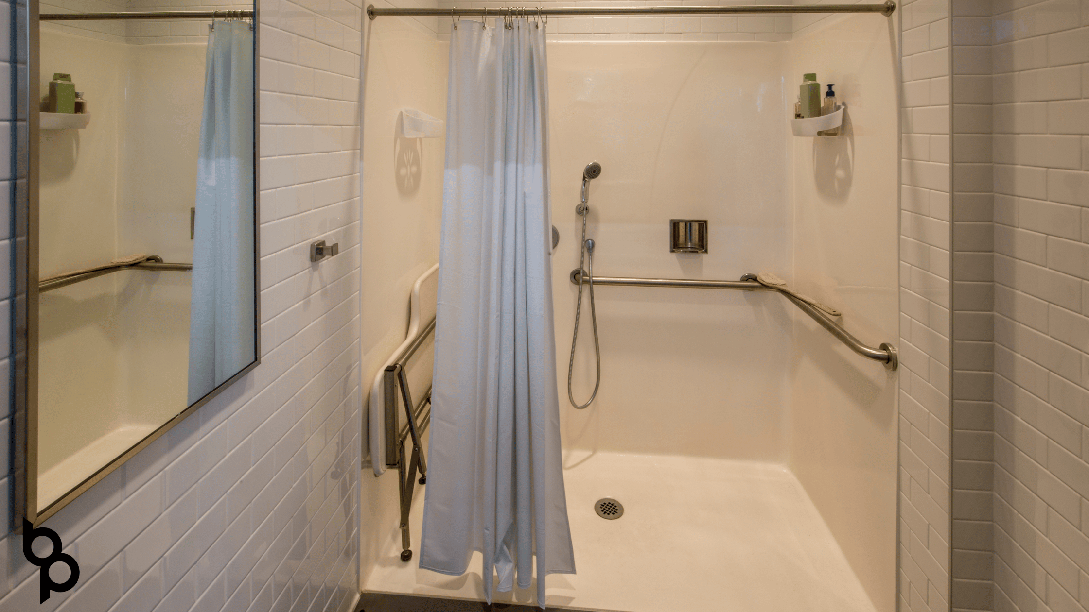 Walk-in shower with grab bars and a fold-down seat — Budd&rsquo;s Plumbing, Heating & Cooling installs and repairs showers and bathtubs throughout Cape May and Atlantic County, NJ
