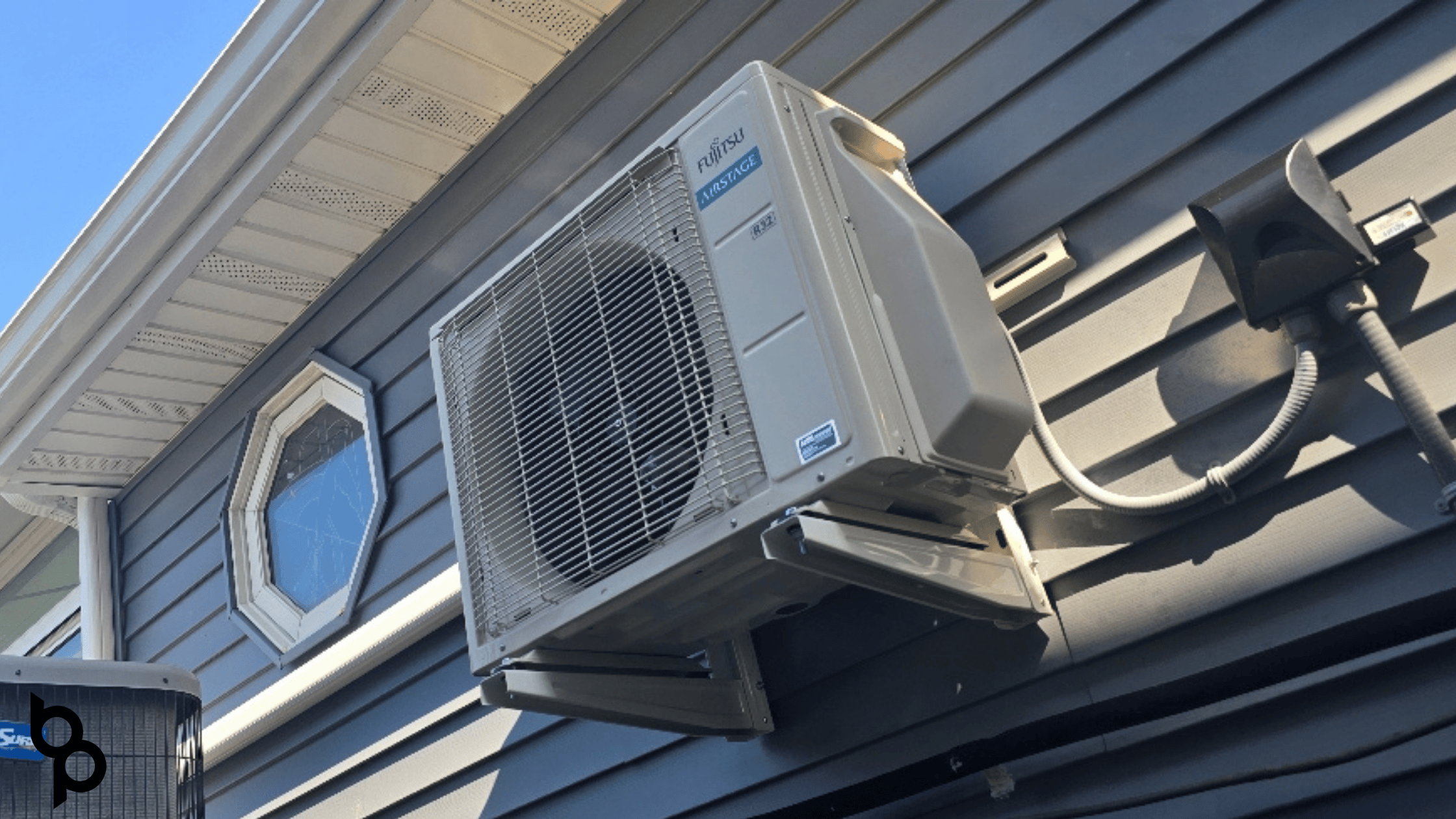 Fujitsu Airstage ductless mini-split outdoor unit installed on a home&rsquo;s exterior wall by Budd&rsquo;s Plumbing, Heating & Cooling in Cape May County, NJ