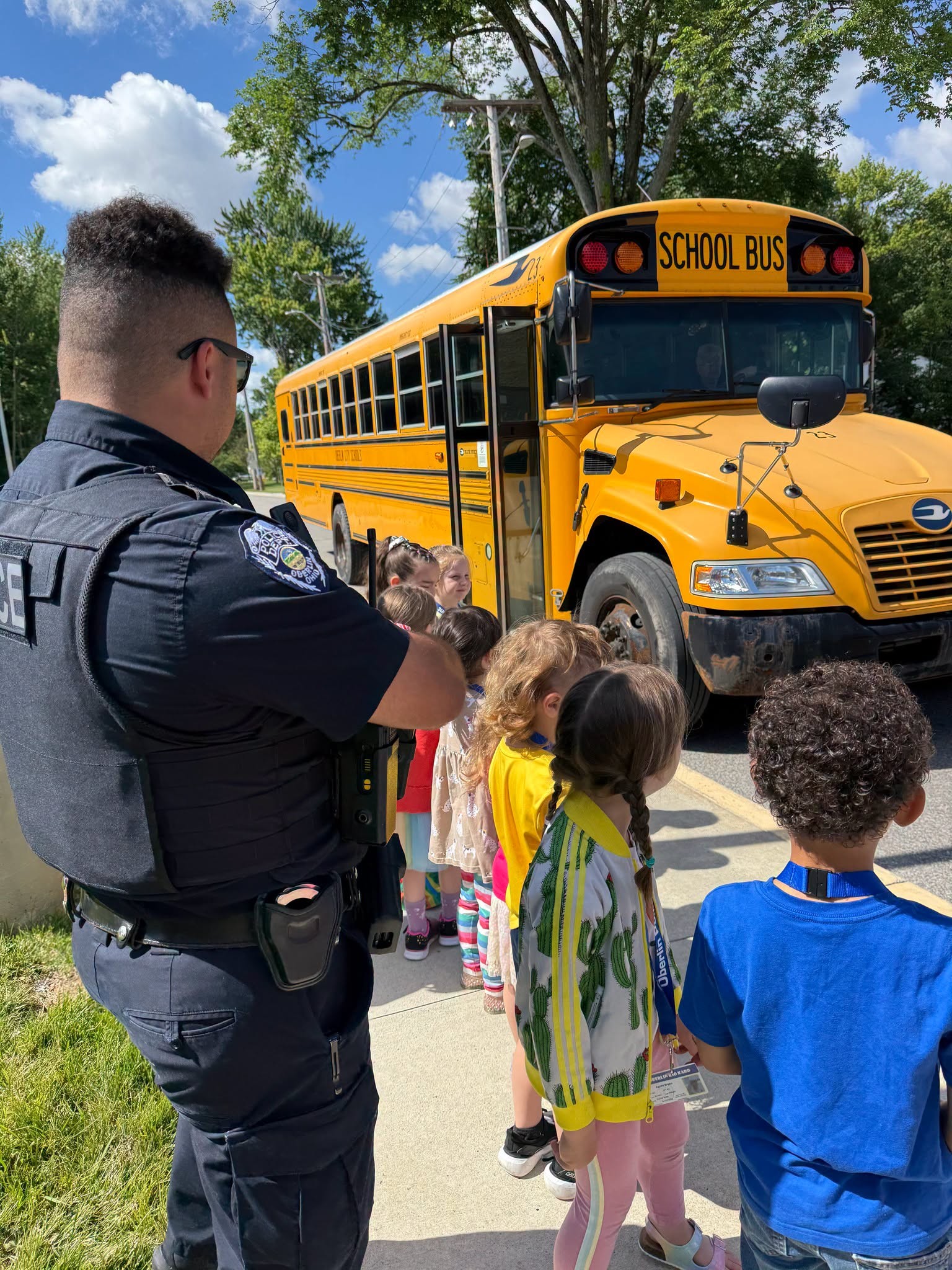 SRO Robinson teaching bus safety at safety town