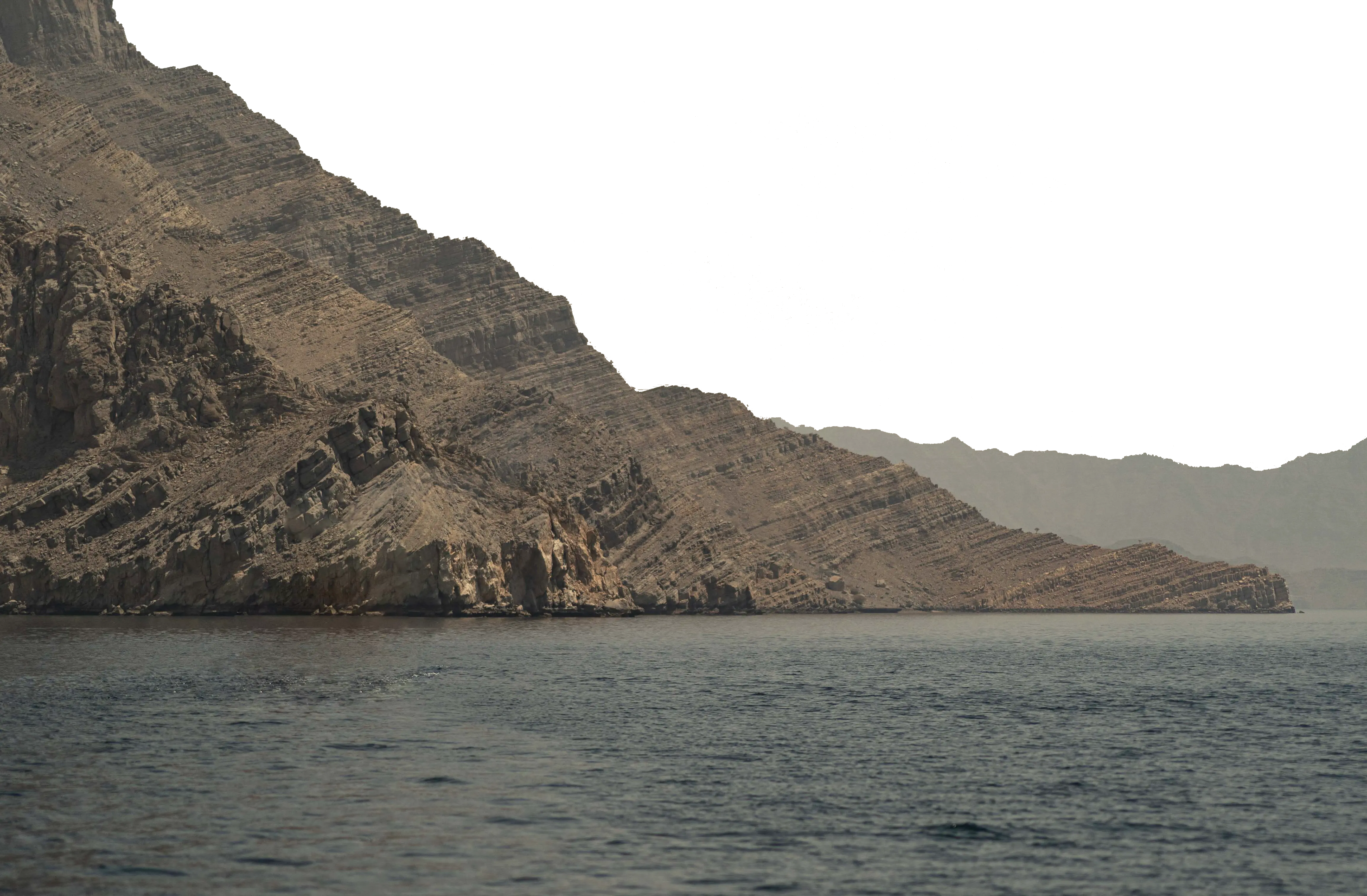 This is a layer for a parallax scrolling effect. A mountains-scape rises from the water.