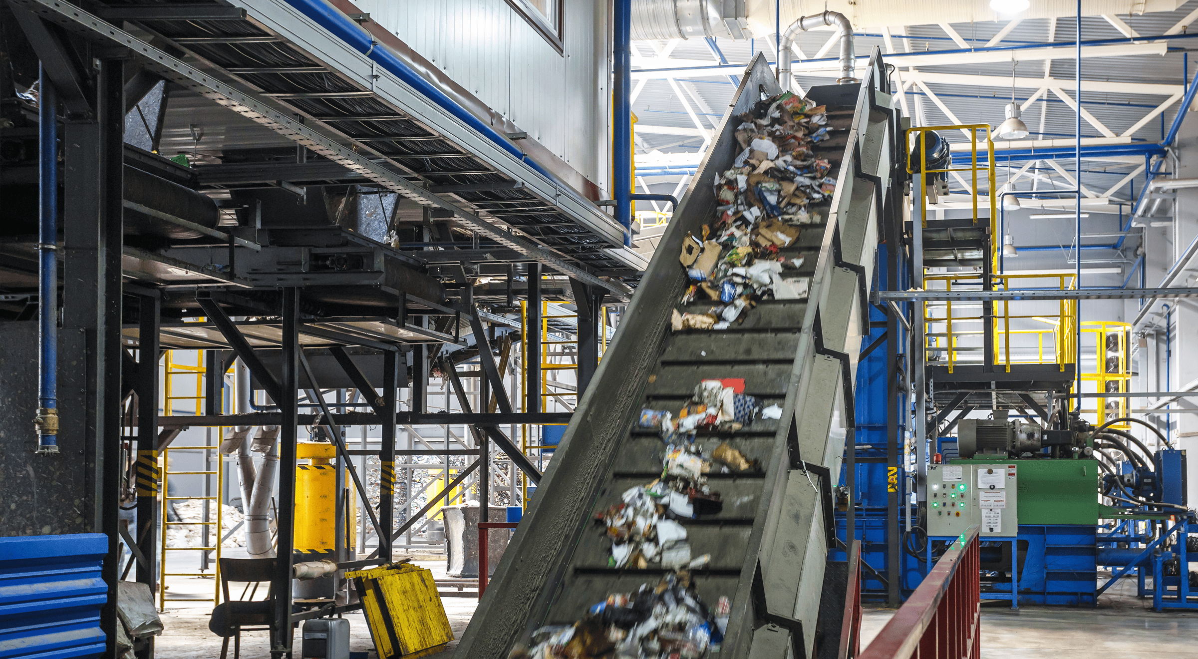 Conveyor belt carrying sorted recyclable materials in a recycling facility