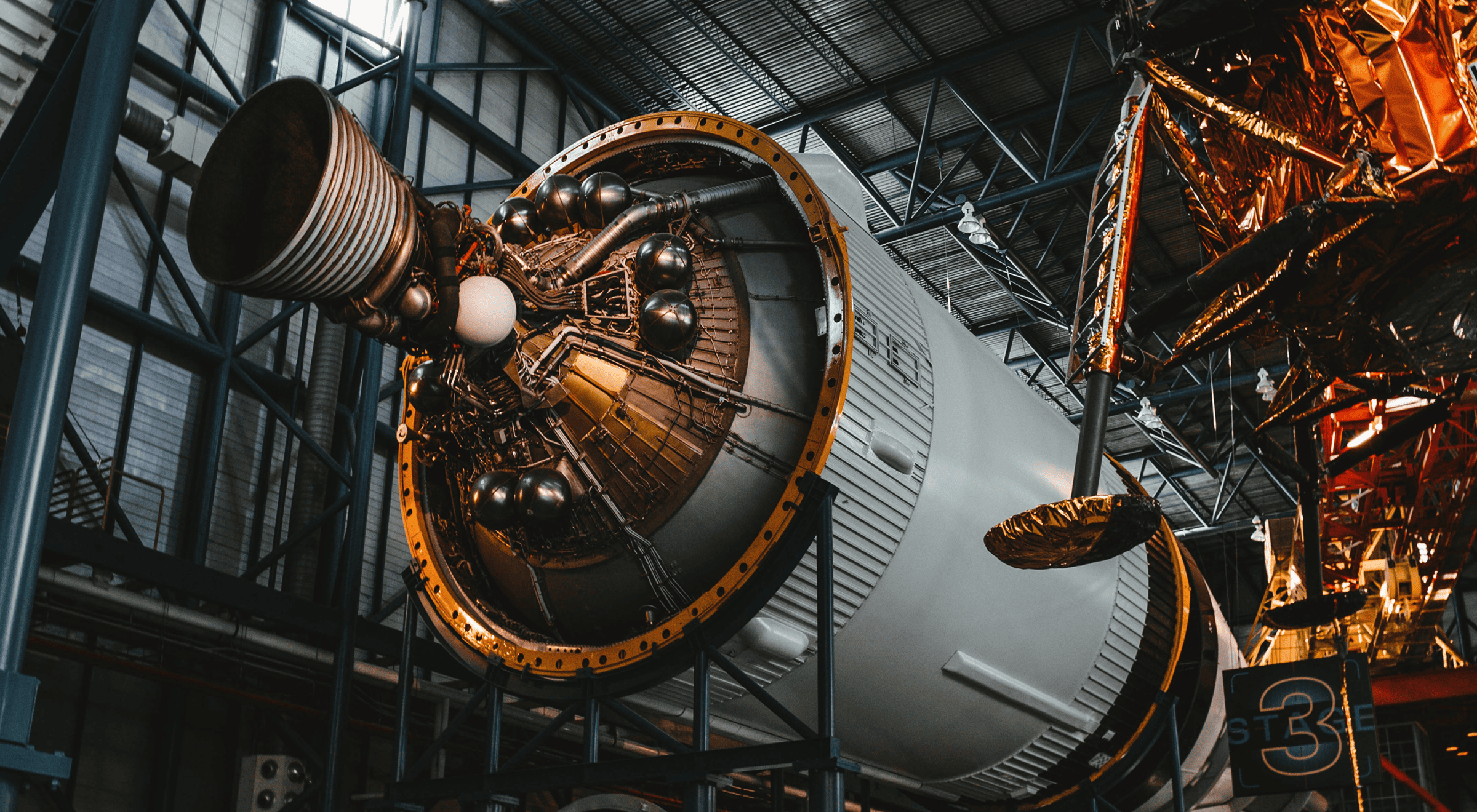 Large rocket engine on display in a museum or exhibition hall