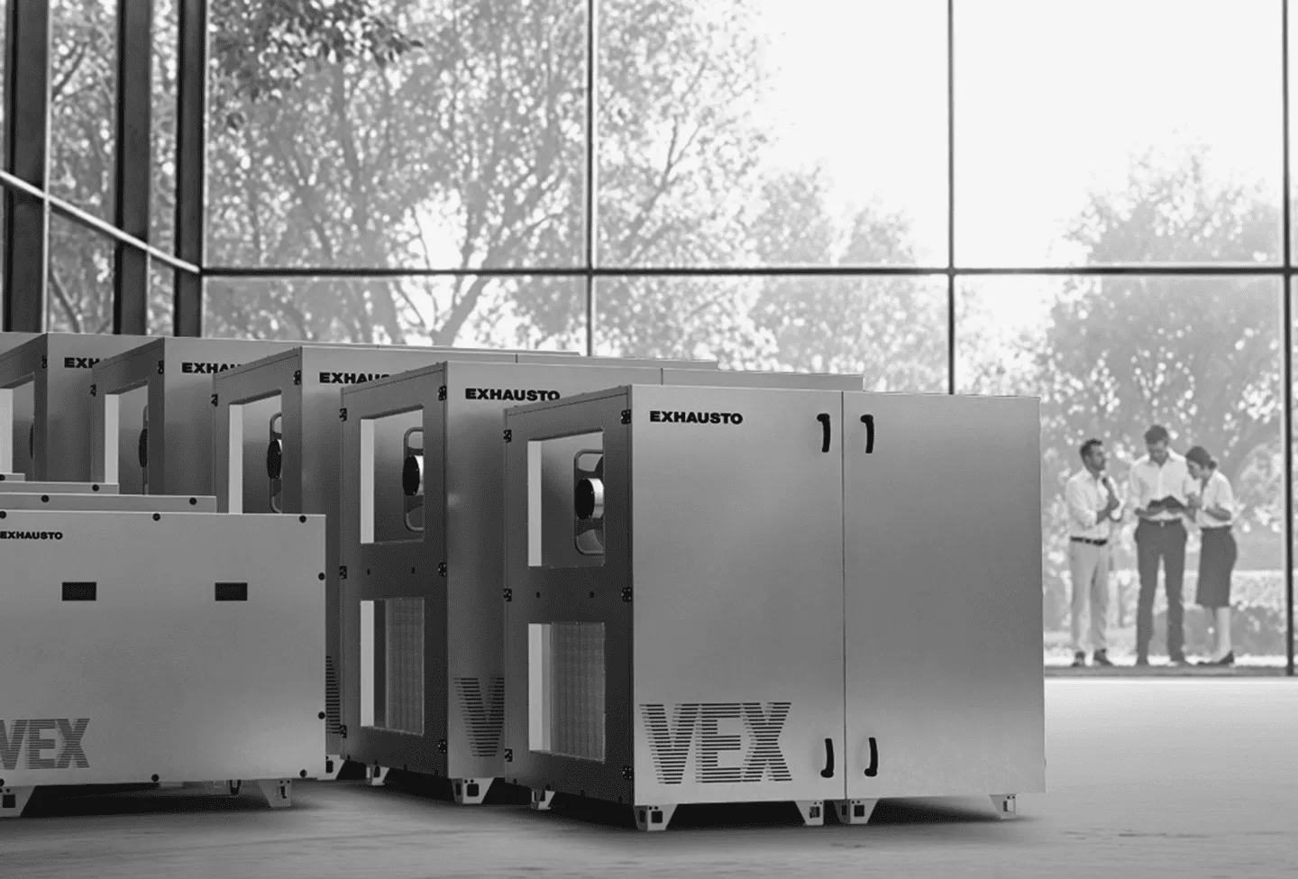 A group of metal boxes sitting in front of a window.