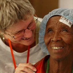 Julie assisting a patient