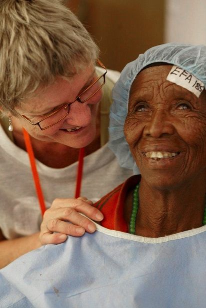 Julie assisting a patient