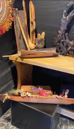 A stand with different artworks sitting on it