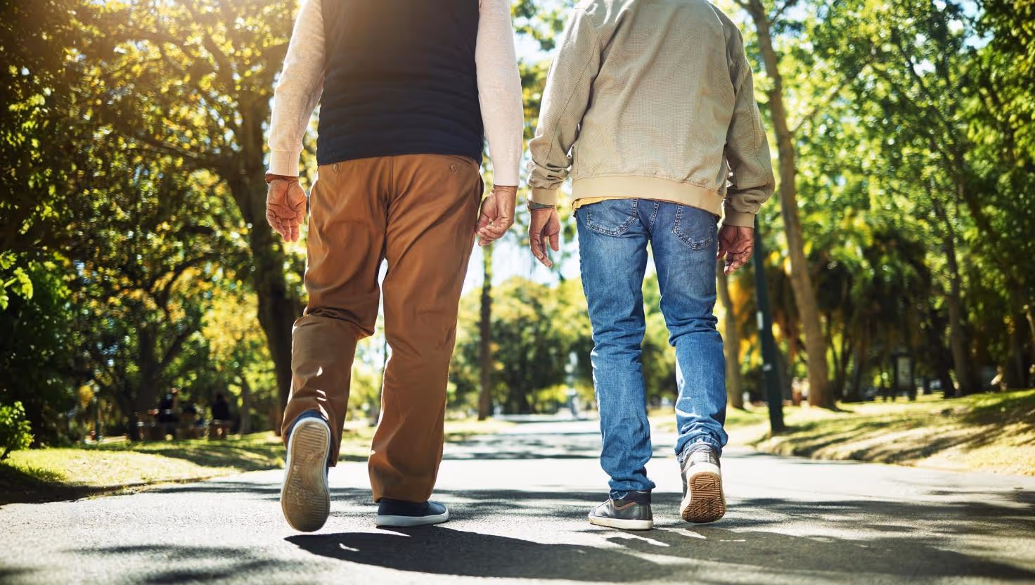 stock image of 2 elderly people walking away
