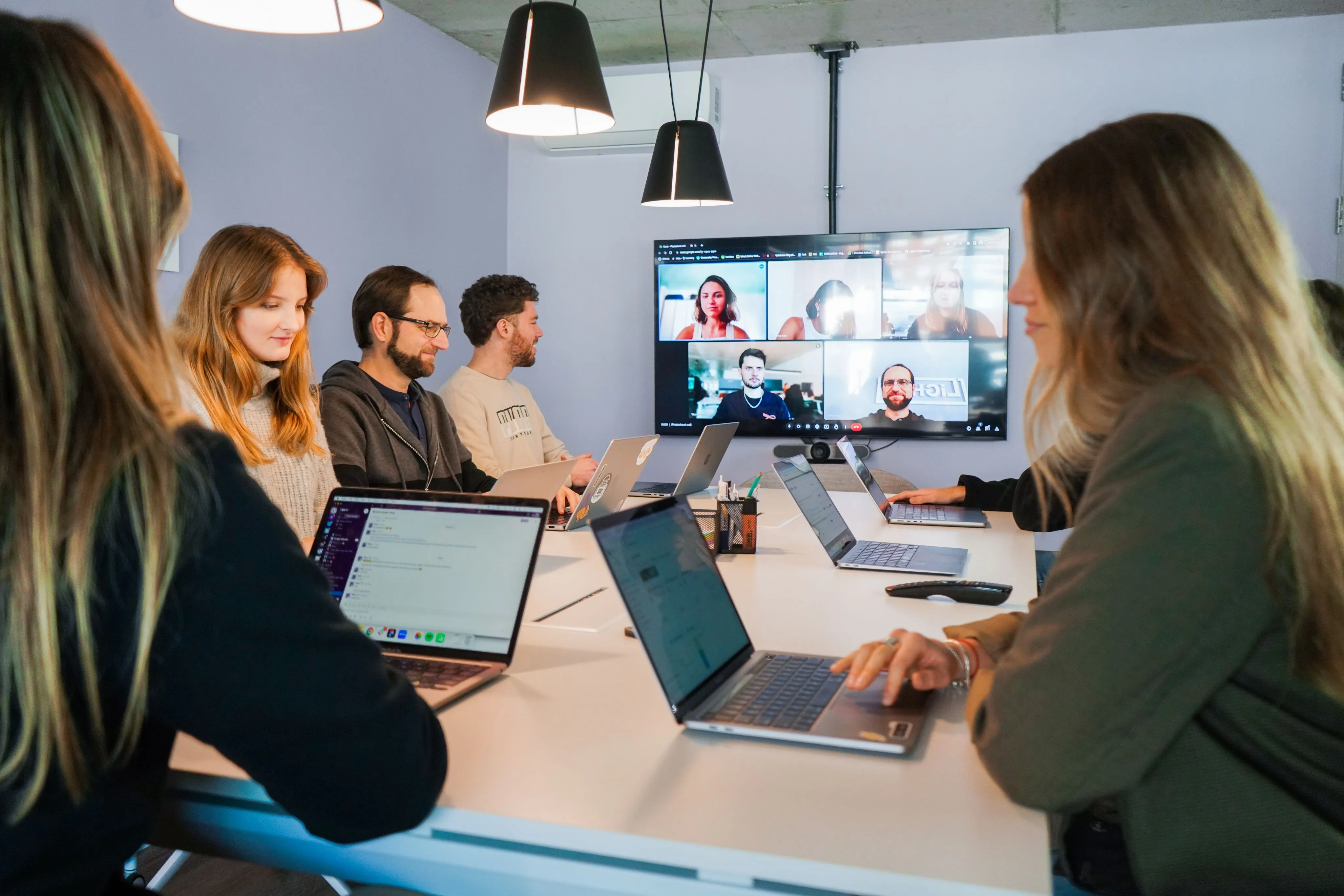 a videocall with a group of smiling people