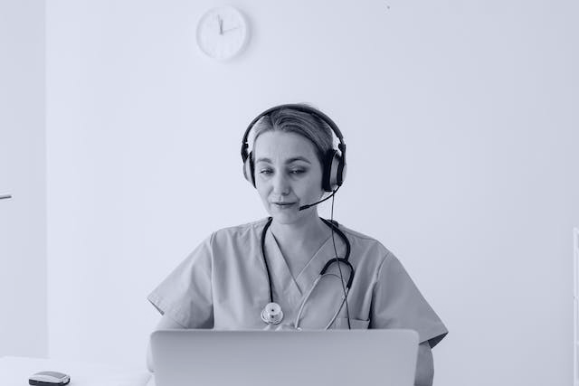 A female pharmacist having a video call through her computer