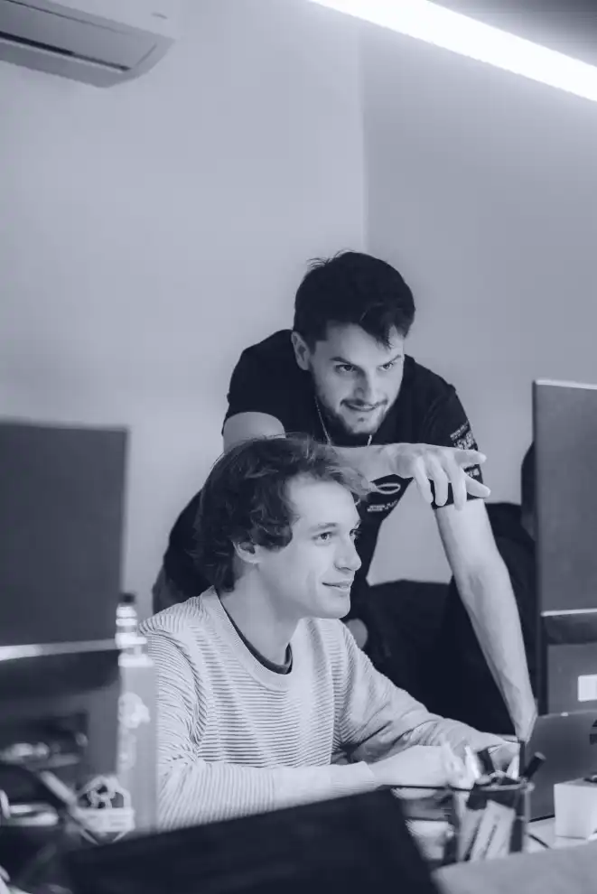 A group of teammates discussing about a digital health product on their computers while having a virtual meeting.