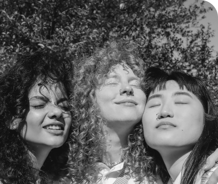 three asian community girls hugging