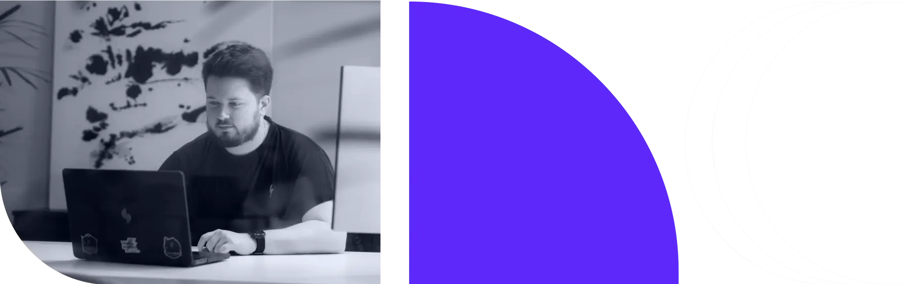 A developer focused on a laptop, representing common questions about EHR migration strategy