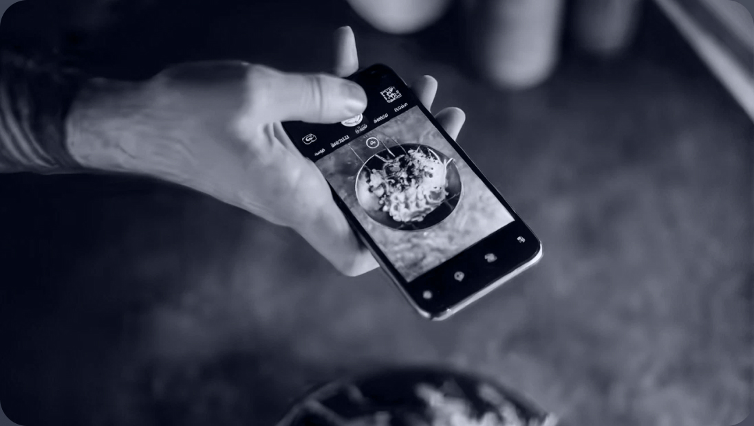 Hand holding a smartphone with a health tracking app