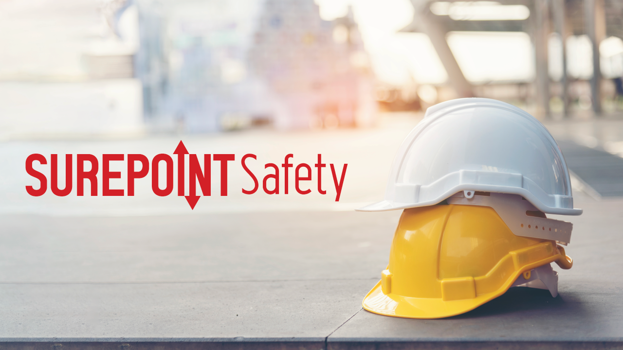 Image of safety helmets, with the surepoint logo