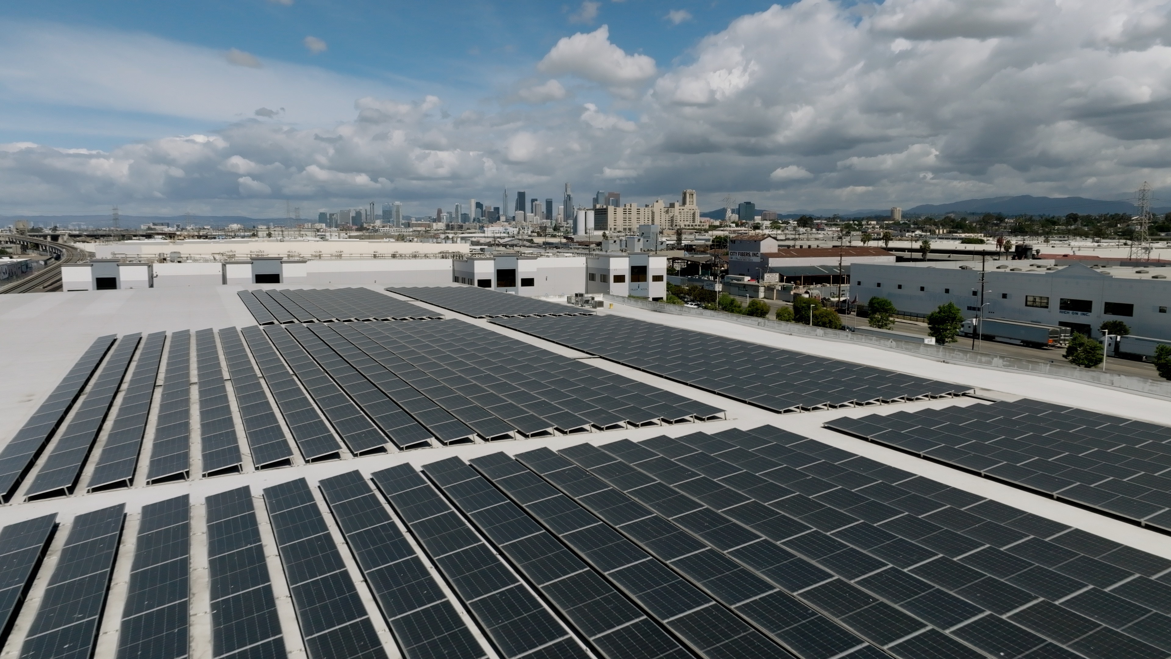 Aerial view of a commercial rooftop solar installation