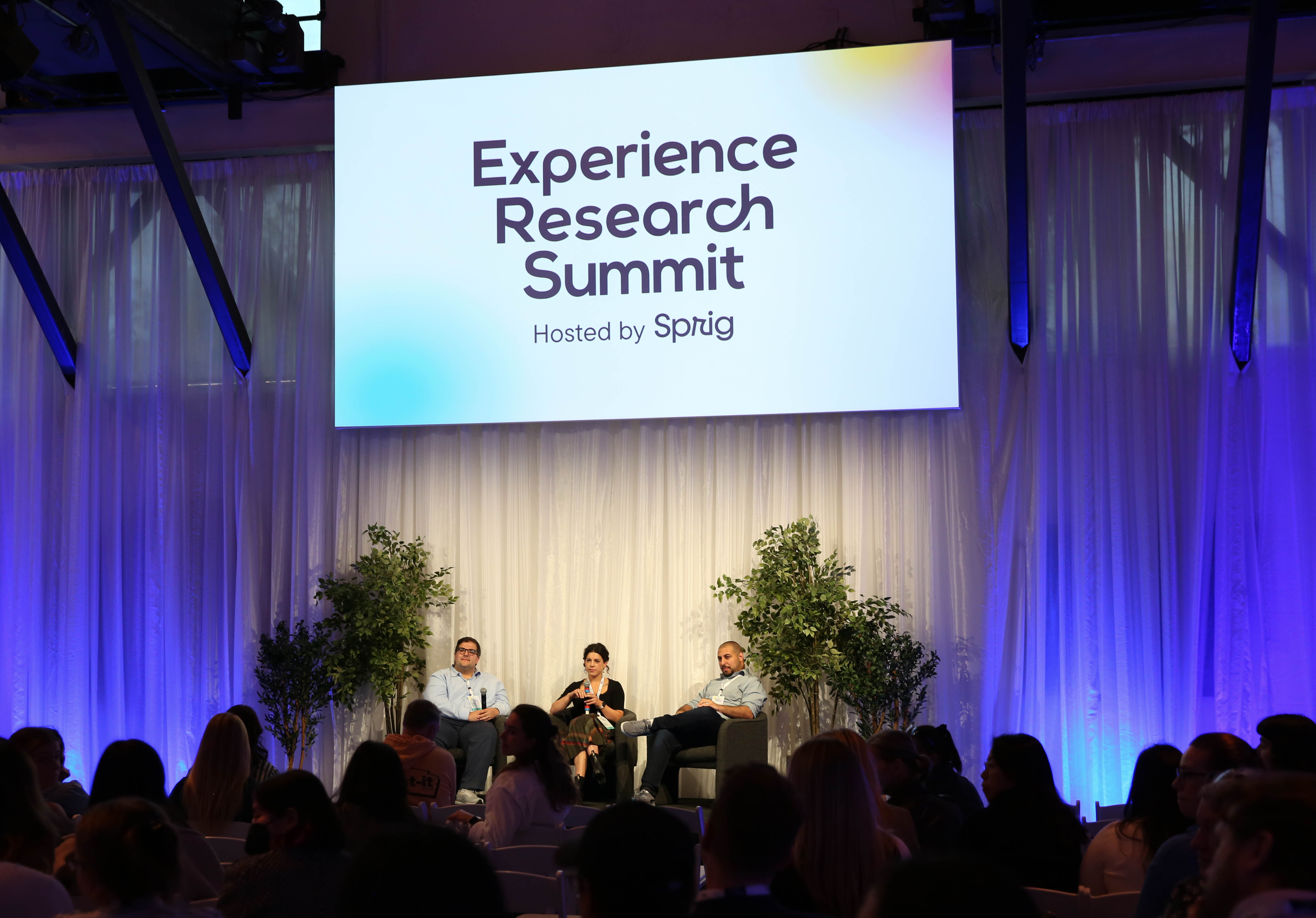 Panel speakers on stage at the Experience Research Summit in San Francisco