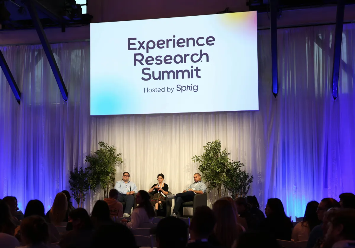 Panel speakers on stage at the Experience Research Summit in San Francisco