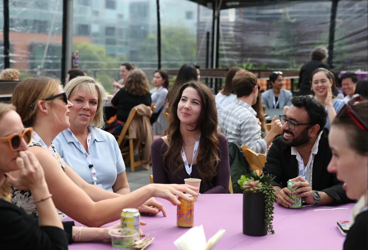 Close up of Attendees at the Experience Research Summit in San Francisco Networking at rooftop event
