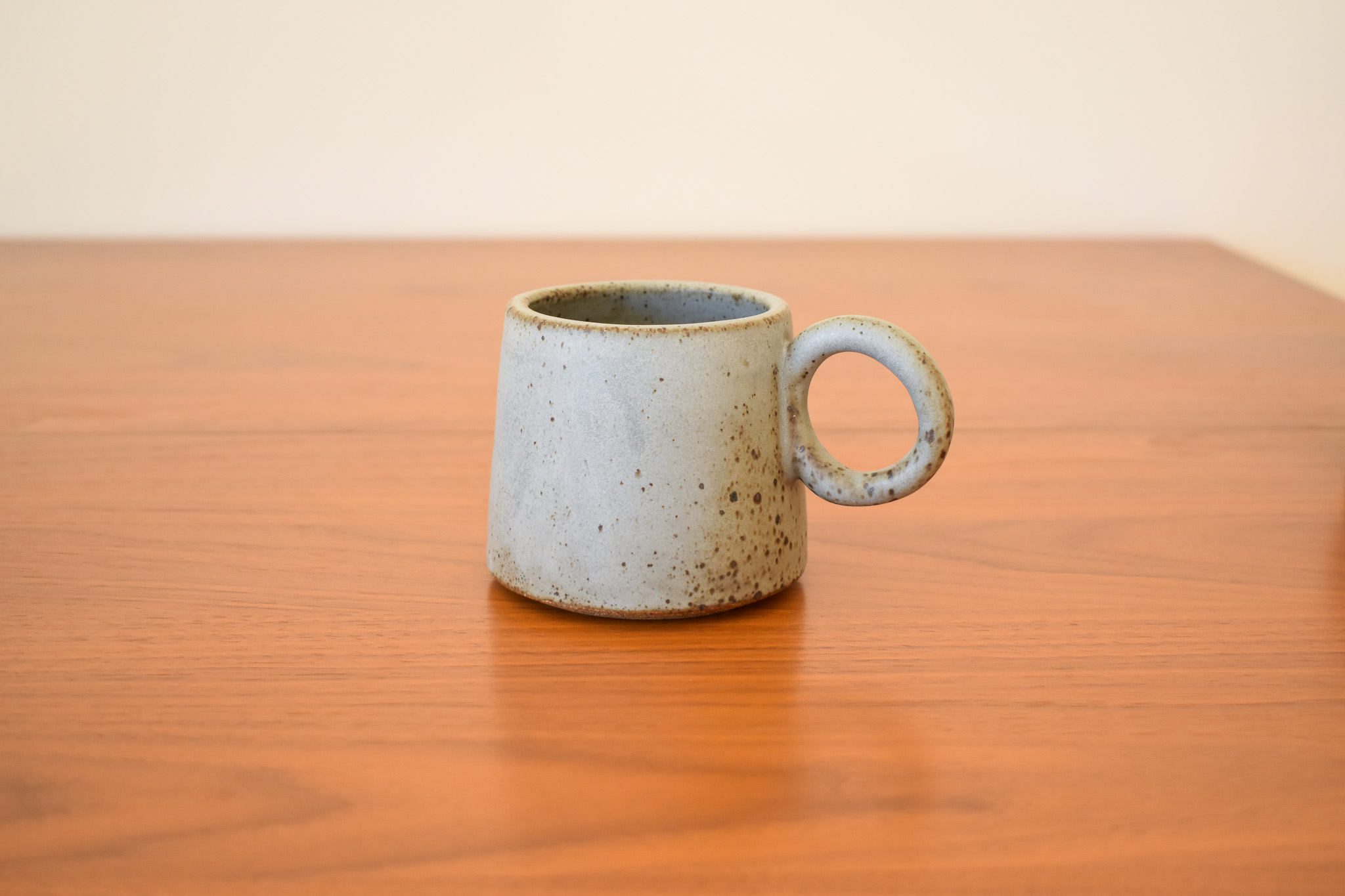 Glazed stoneware. 3" wide opening x 3" tall. Holds 12 fl oz. Two of the four have dark speckle variation, and the other two are a little more opaque grey with light speckling. If you have a preference of which you'd like, send me a message!
