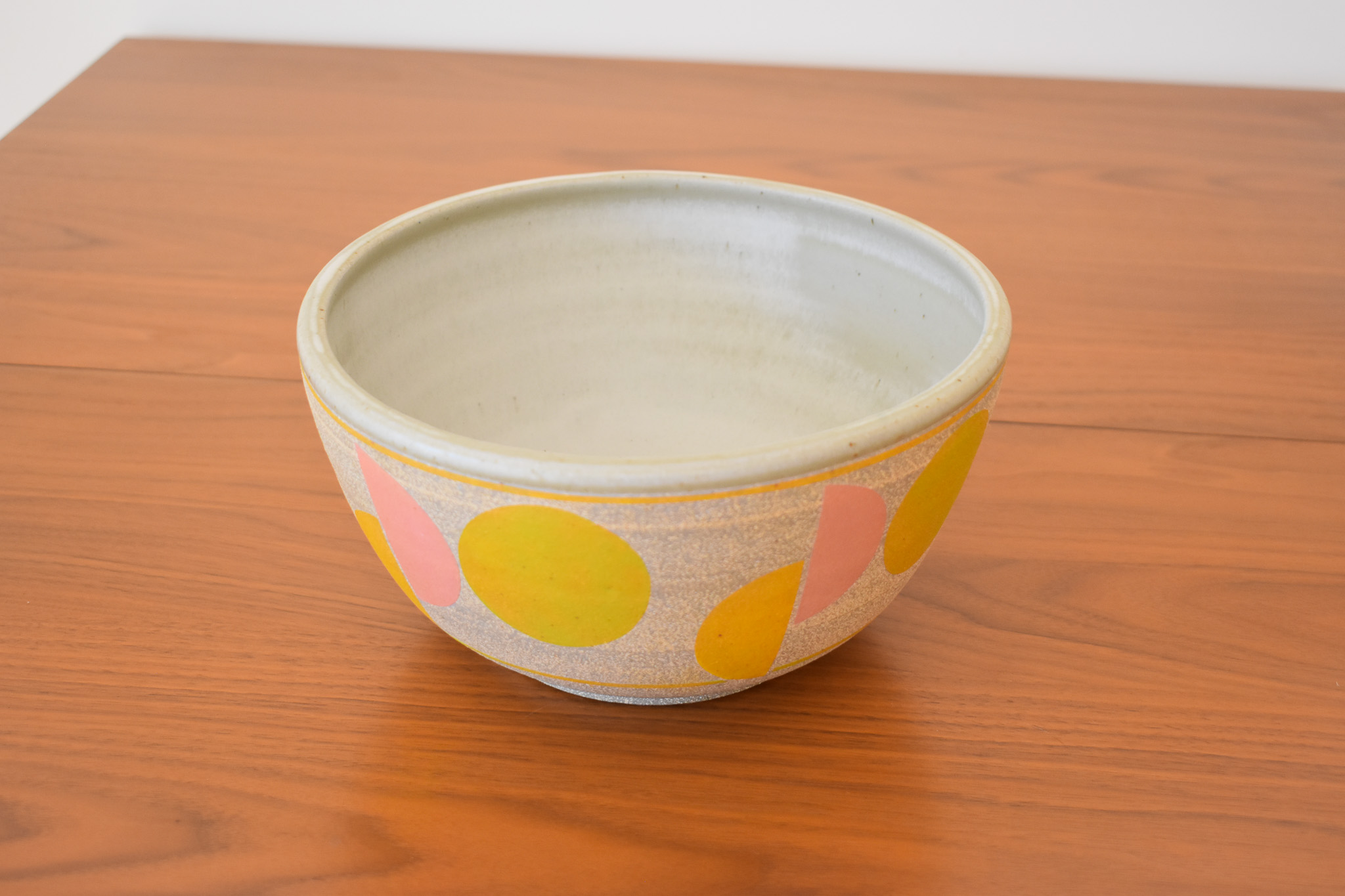 Wheelthrown with stoneware and hand painted using non-toxic underglazes and a white matte glaze. Measures 9" wide x 4.75" tall.