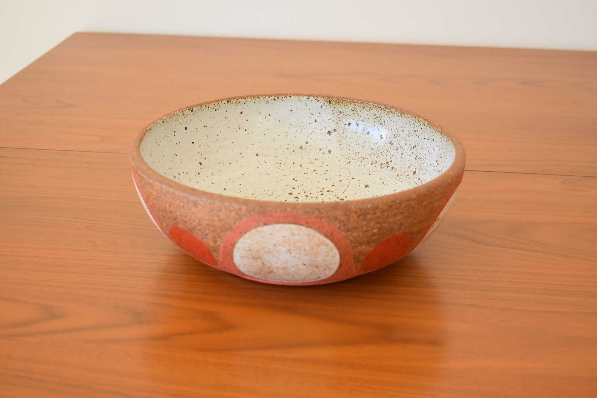 Wheelthrown with stoneware and hand painted using non-toxic underglazes and a white matte glaze. Measures 9.5" wide x 3.25" tall.