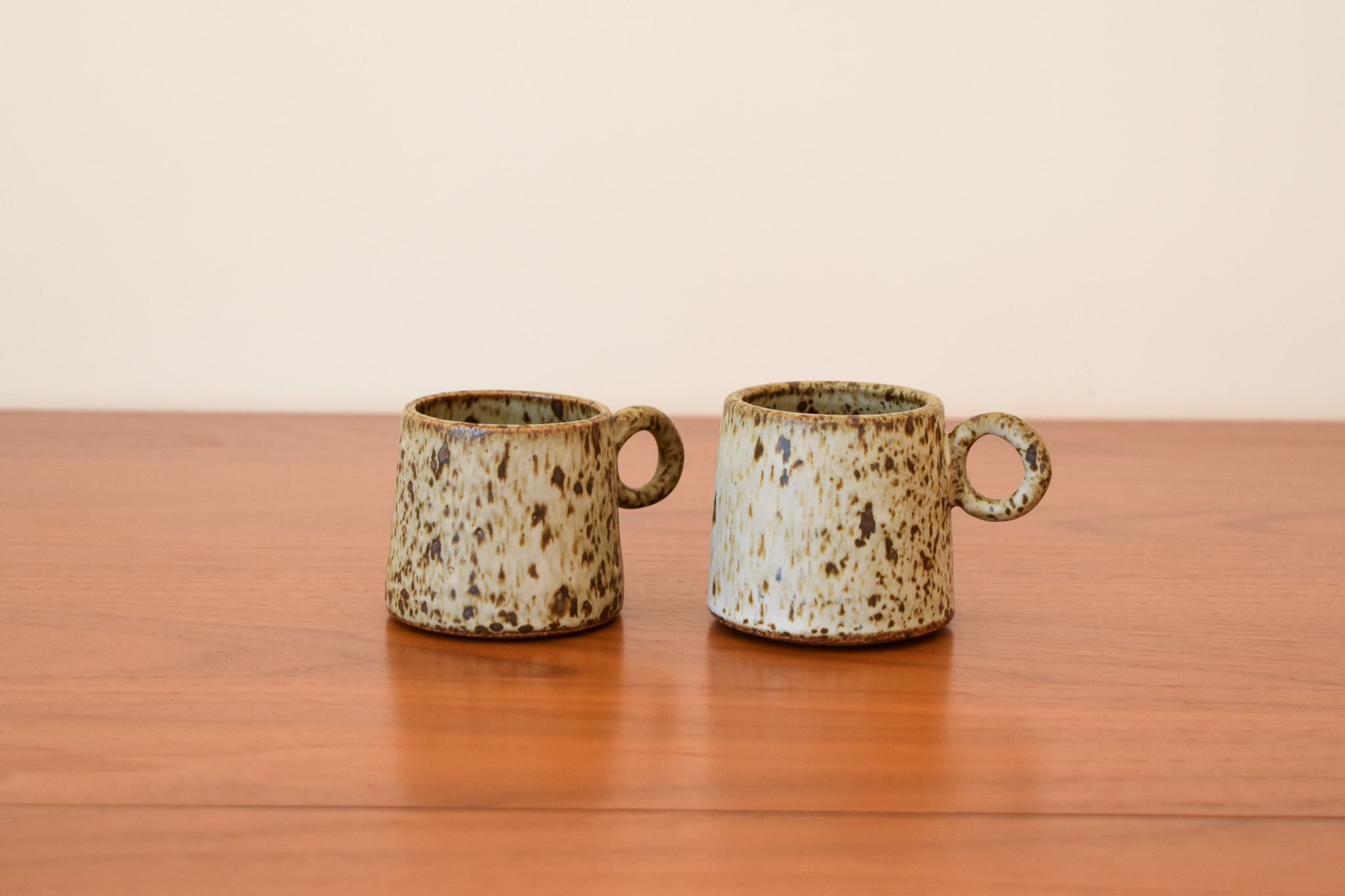 Glazed stoneware. Holds 4 fl oz. Each cup sold separately.
