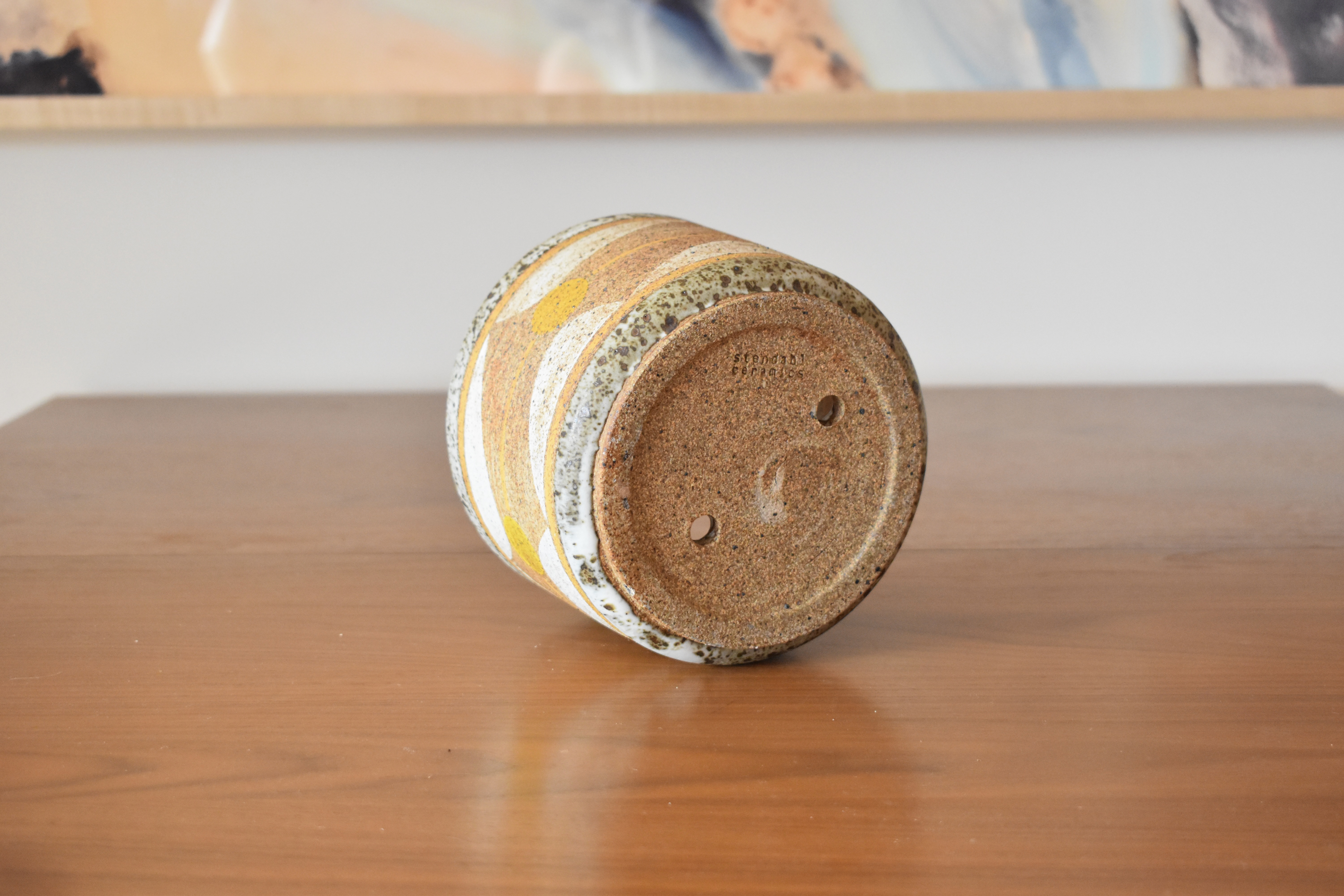 Wheelthrown with stoneware and hand painted using non-toxic underglazes and a white glossy glaze. Planter measures 6" wide x 4.5" tall. Does not come with a base – if you'd like to purchase one separately, get in touch.