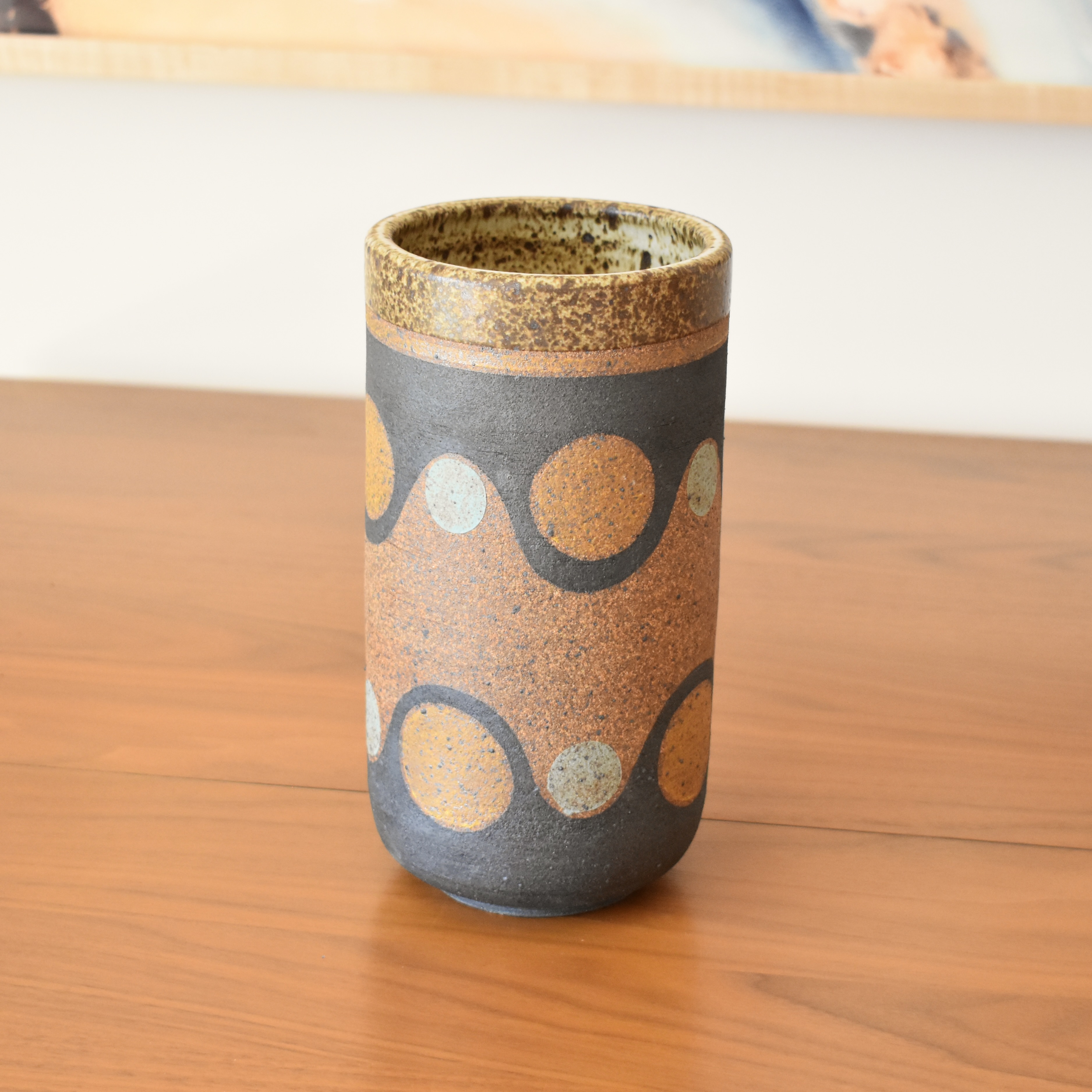 Wheelthrown with stoneware and painted with non-toxic underglazes. Outer lip and interior glazed in a heavily freckled matte white/brown glaze.
