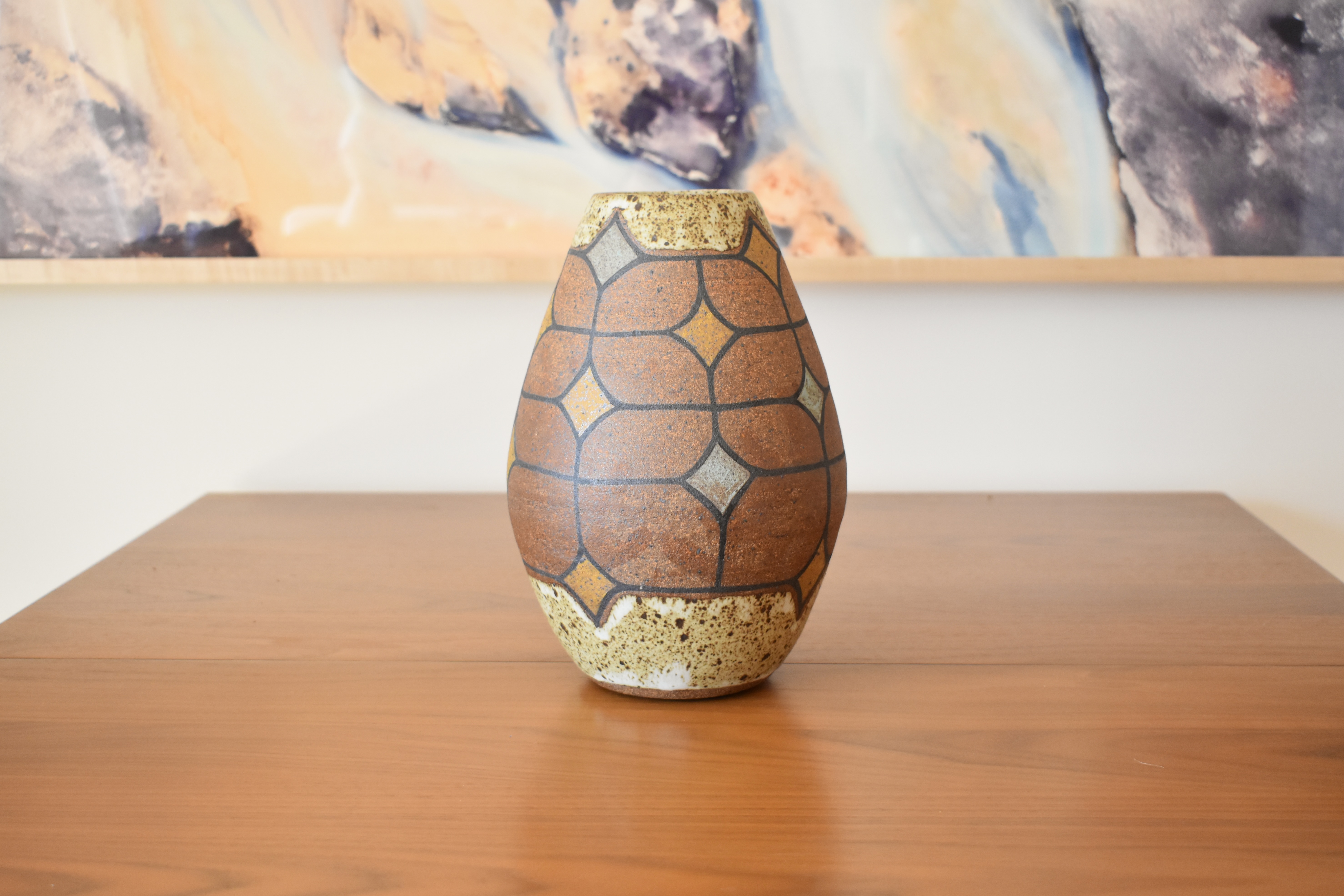 Wheelthrown with stoneware and handpainted with non-toxic underglazes. Interior and outer lip glazed in a matte, heavily freckled white glaze.