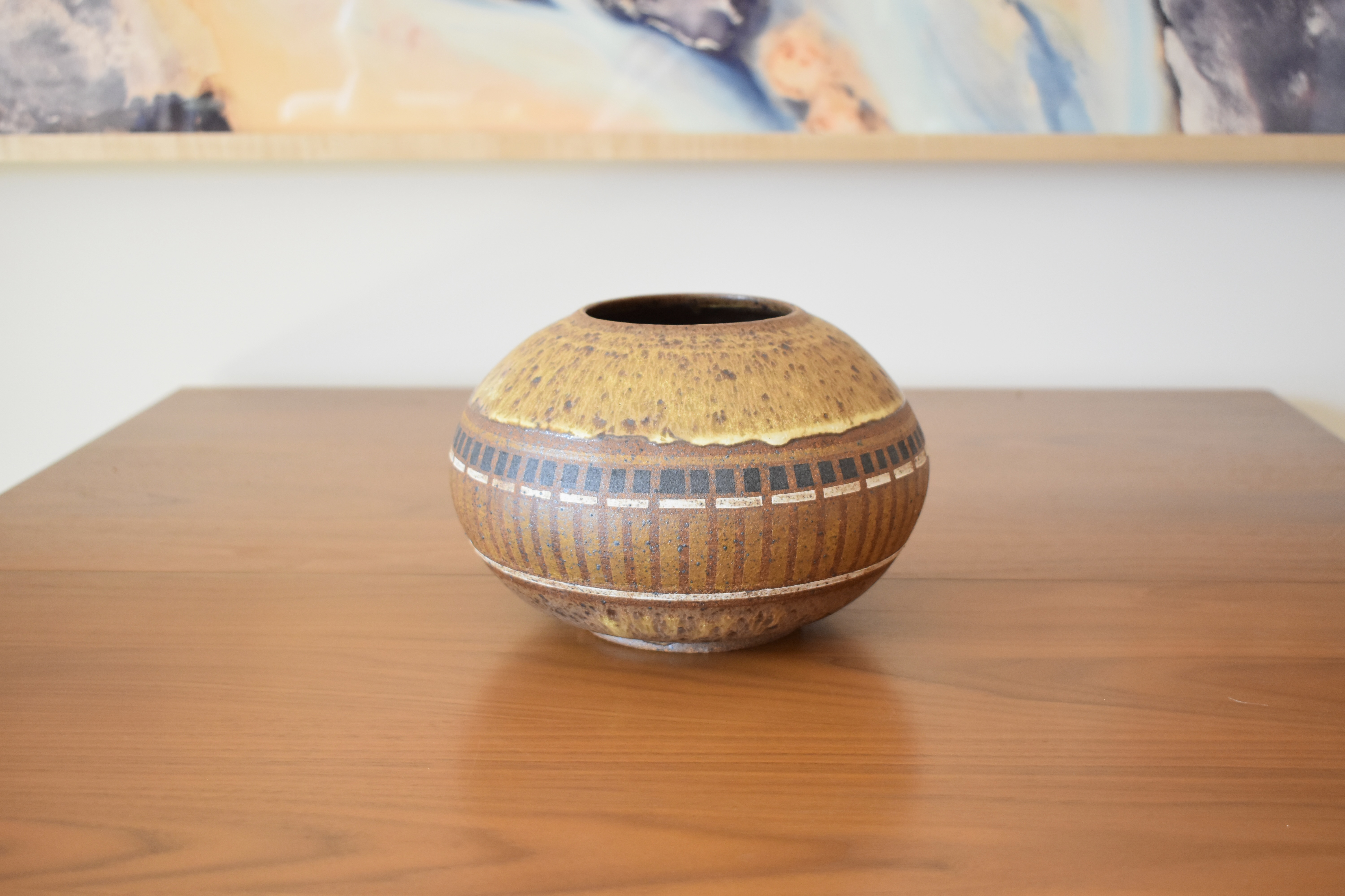 Wheelthrown with stoneware and handpainted with non-toxic underglazes. Exterior and interior glazed in a matte, heavily freckled off white glaze.