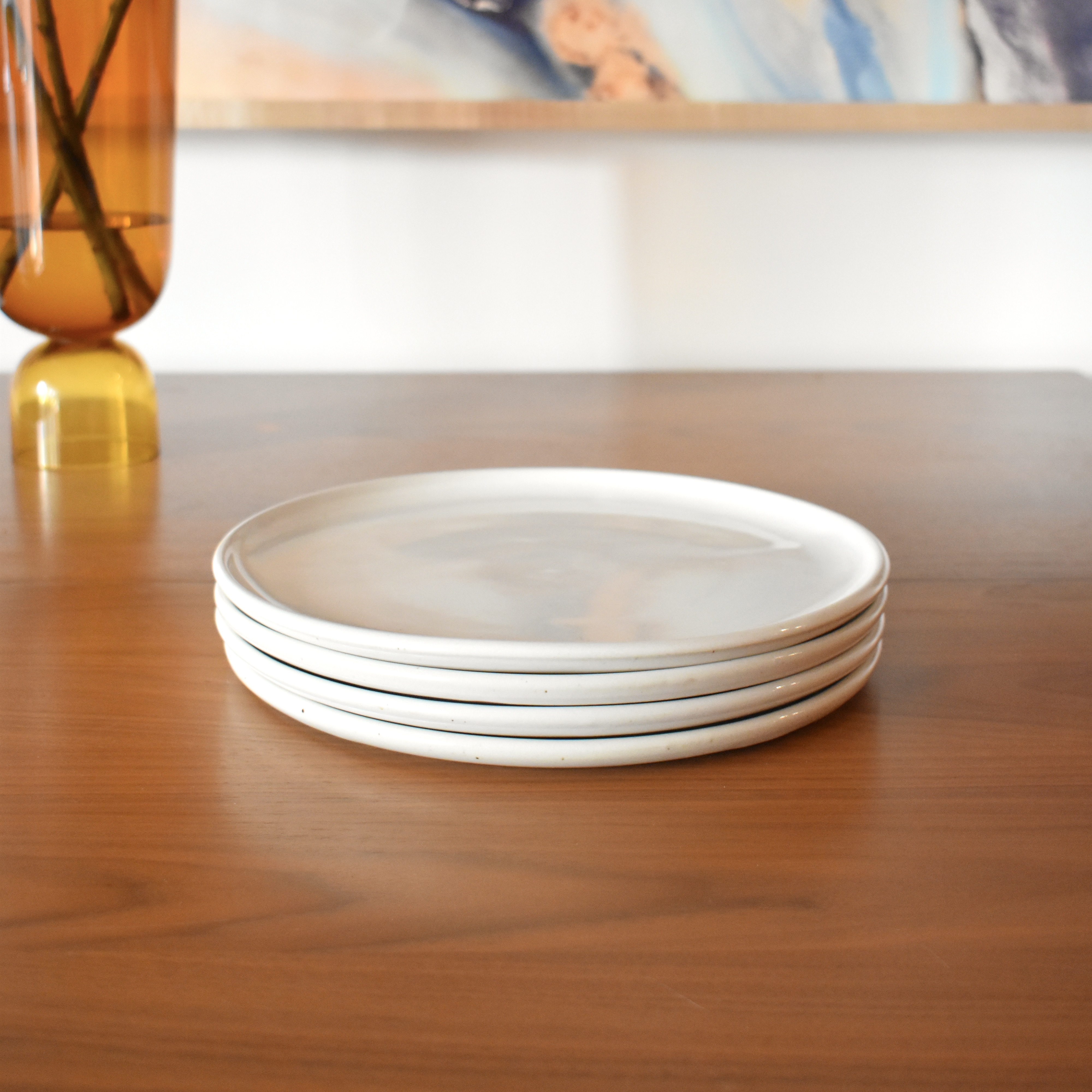 Wheelthrown with porcelain. ~10" diameter. Sold as a set of four.
