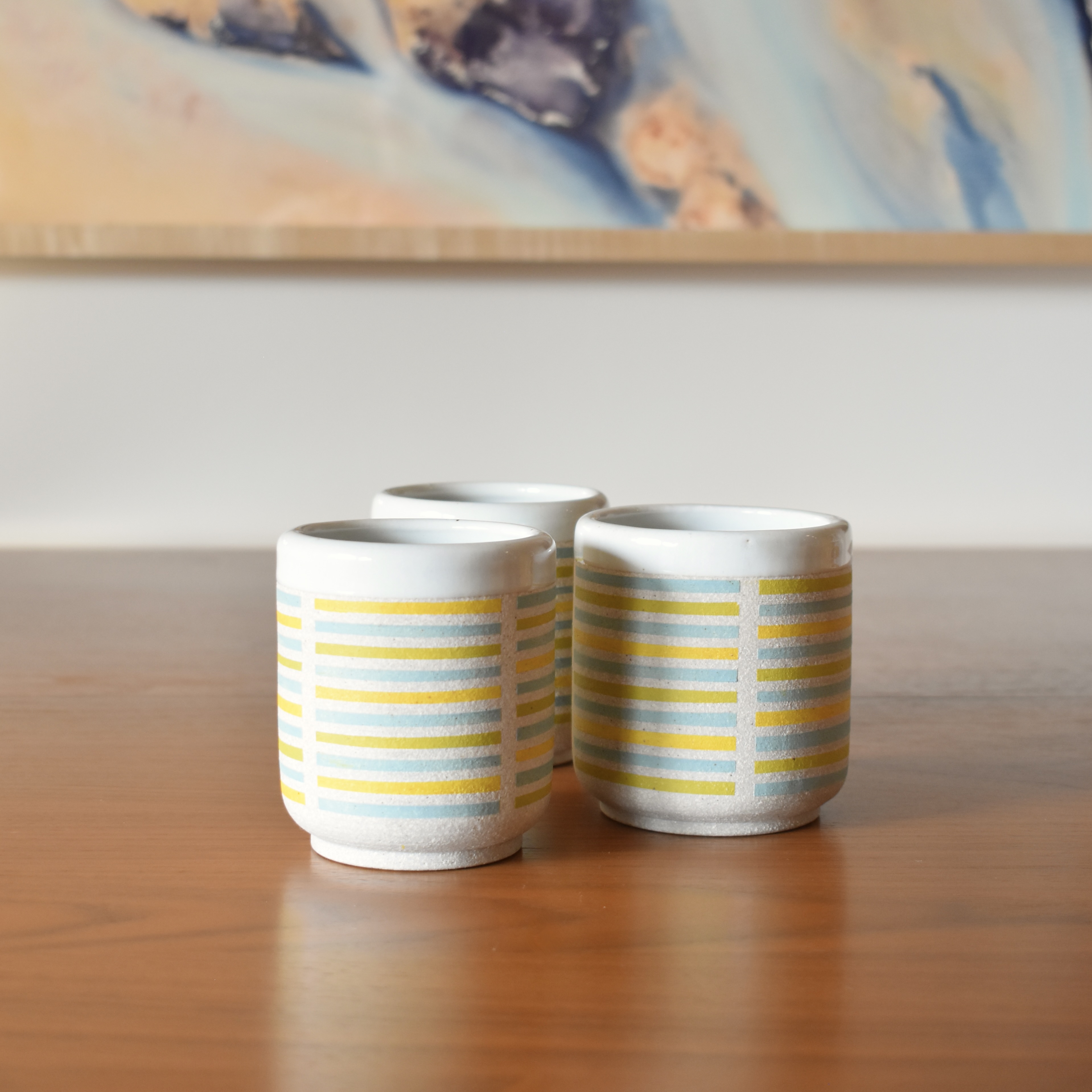 Wheelthrown with stoneware and hand painted using non-toxic underglazed. Glazed glossy white on the interior and outer lip. 3.25" wide x 3.5" tall. Holds ~10fl. oz. Each tumbler sold separately.