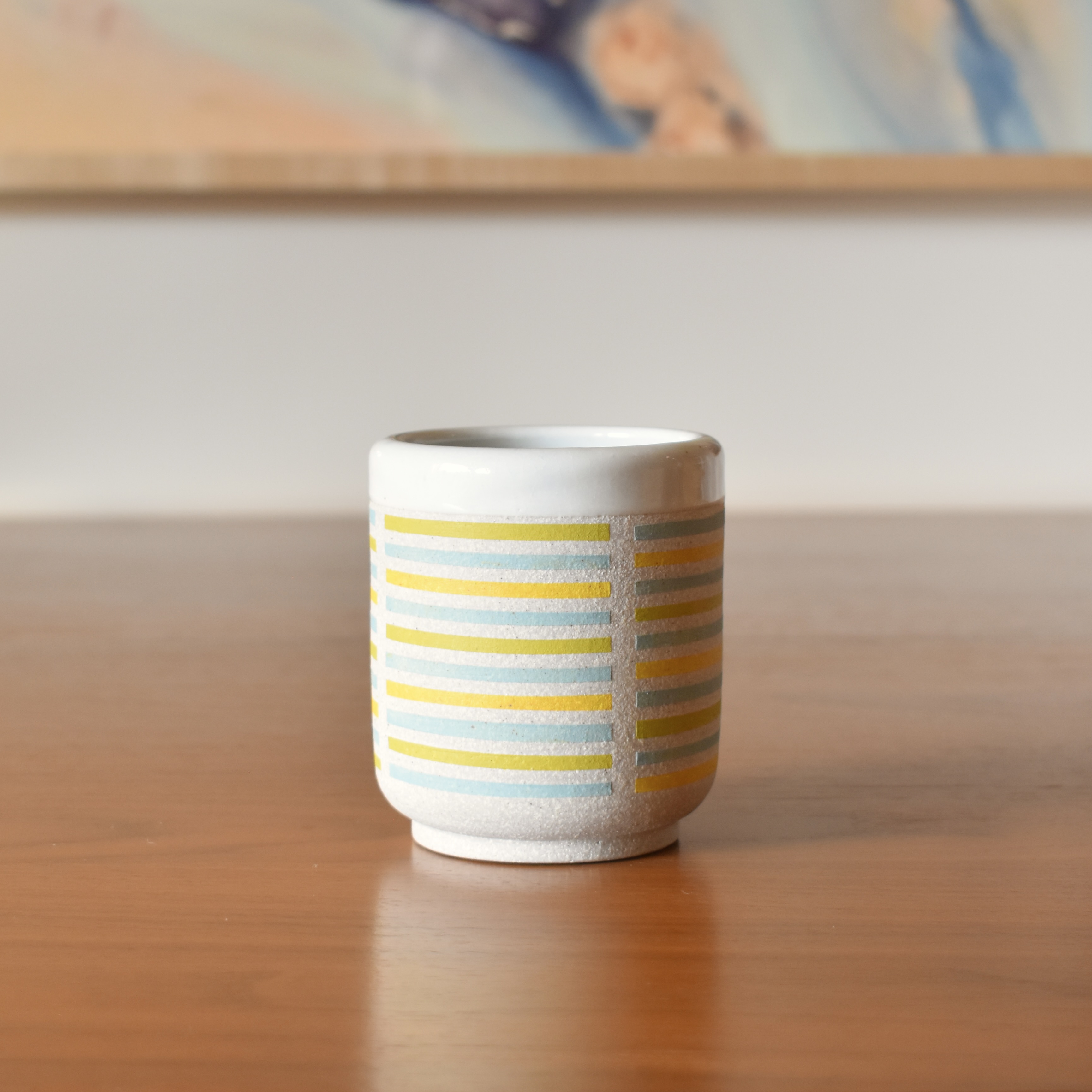 Wheelthrown with stoneware and hand painted using non-toxic underglazed. Glazed glossy white on the interior and outer lip. 3.25" wide x 3.5" tall. Holds ~10fl. oz. Each tumbler sold separately.