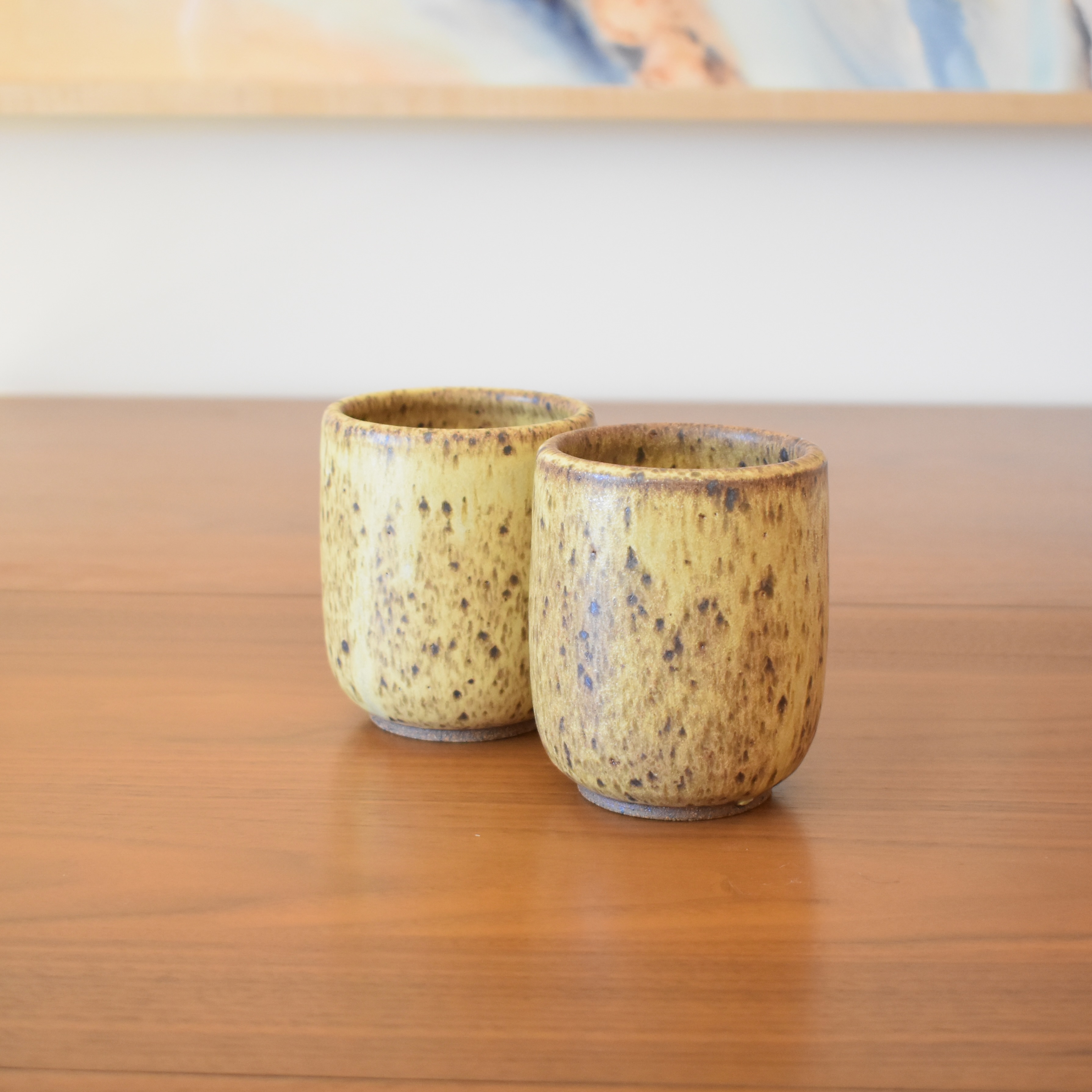 Wheelthrown with stoneware. Glazed in a v-ripe-banana-like glaze. 3.25" wide x 4" tall. Holds approximately 14 fl oz.