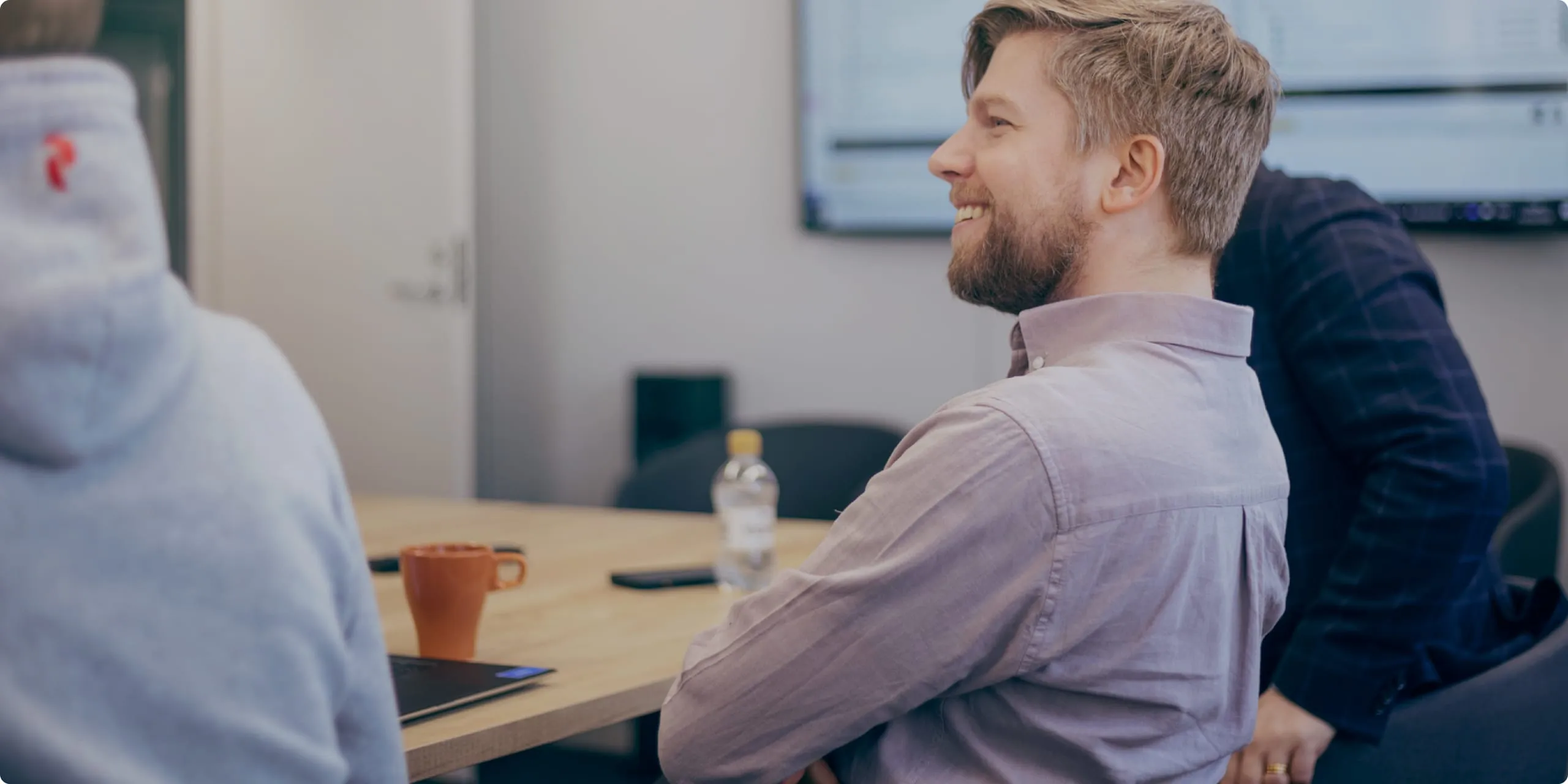 Three colleagues in a meeting in the Funidata office