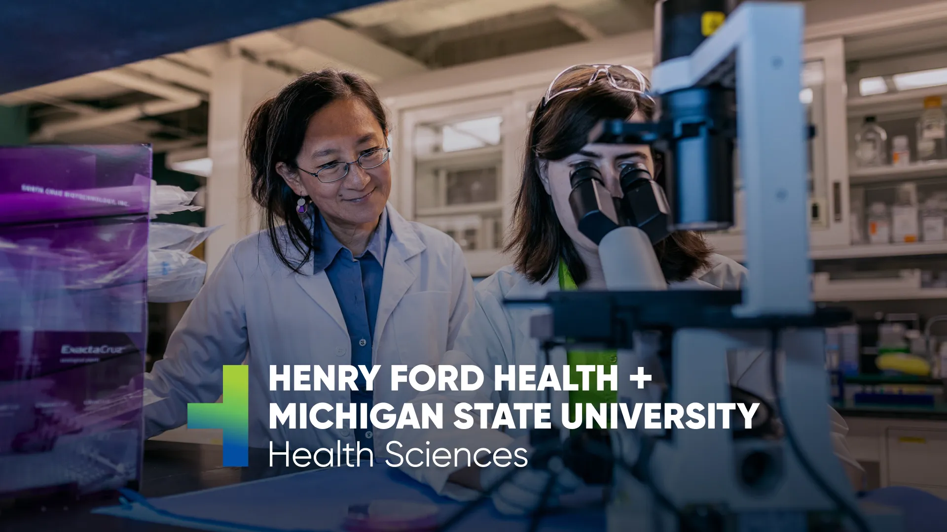 Henry Ford Health + MSU researchers work in lab.