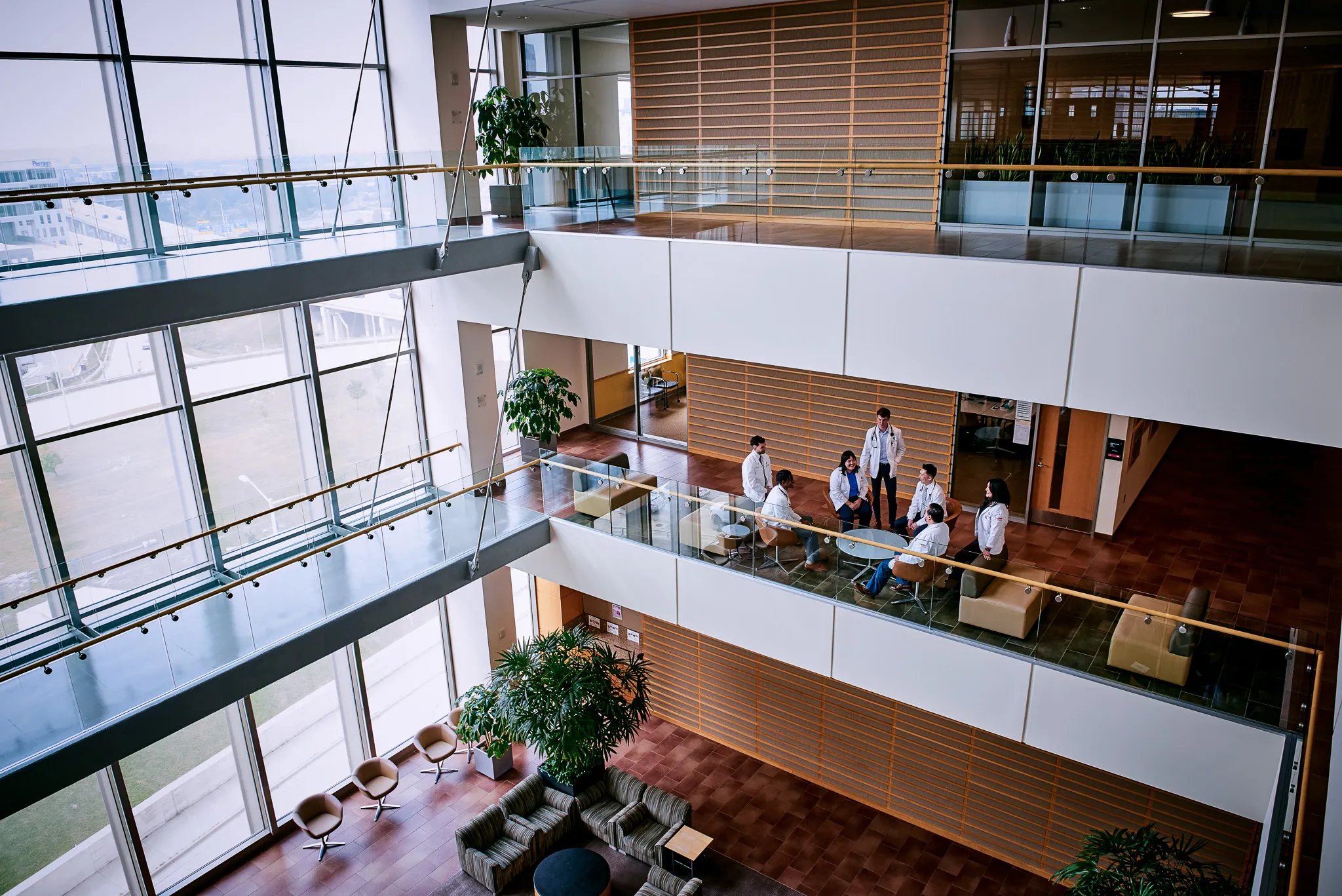 College of Human Medicine students relax in modern building. 