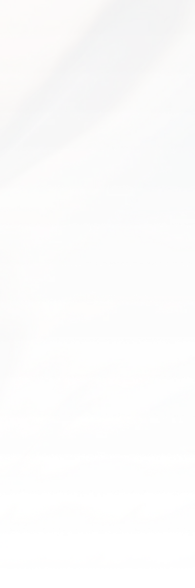 Abstract close-up of a metallic or iridescent surface with soft, gradient reflections in muted purple, pink, and blue tones.